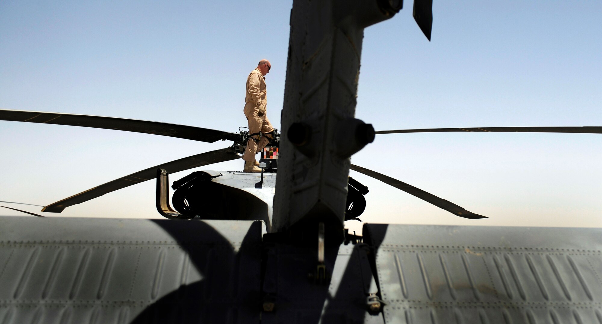 Master Sgt. James Patterson performs a preflight inspection on a HH-60G Pave Hawk June 23 at Camp Bastion, Afghanistan. Sergeant Patterson is a flight engineer with the 129th Expeditionary Rescue Squadron. (U.S. Air Force photo/Staff Sgt. Shawn Weismiller) 