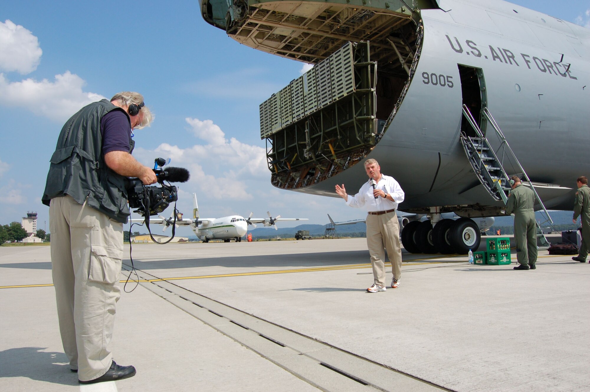 WRIGHT-PATTERSON AIR FORCE BASE, Ohio - WDTN Channel 2, Dayton, reporter Dan Edwards and photographer Don Hatcher flew aboard a C-5 Galaxy belonging to the 445th Airlift Wing June 23-29 to cover a mission the plane was flying. The mission began at Wright-Patt and included stops at two U. S. Air Force bases, Germany and Southwest Asia. The reporter and photographer conducted interviews with the crew and with Airmen at various locations along the way. (Air Force photo/Maj. Jose Cardenas)