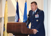 Colonel John Lipinski, 615th Contingency Response Wing commander speaks to the audience during the 571st Contingency Response Group change of command ceremony. (U.S. Air Force photo by Civ/Nan Wylie) 