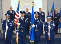 During the 571st Contingency Response Group change of command ceremony the Travis Honor Guard present "The Colors" while left to right Colonel John Lipinski, 615th Contingency Response Wing commander, Colonel Paul Judge, the outgoing 571st Contingency Response Group commander, Colonel Tracy Skelton, the incoming 571st Contingency Response Group commander and the 571st Contingency Response Group First Sergeant, Master Sergeant Craig Brown render honors to the flag. (U.S. Air Force photo by Civ/Nan Wylie) 