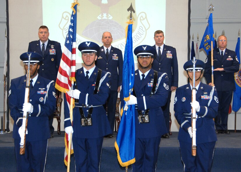 During the 571st Contingency Response Group change of command ceremony the Travis Honor Guard present "The Colors" while left to right Colonel John Lipinski, 615th Contingency Response Wing commander, Colonel Paul Judge, the outgoing 571st Contingency Response Group commander, Colonel Tracy Skelton, the incoming 571st Contingency Response Group commander and the 571st Contingency Response Group First Sergeant, Master Sergeant Craig Brown render honors to the flag. (U.S. Air Force photo by Civ/Nan Wylie) 