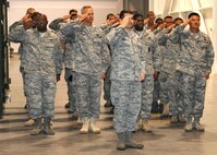 Members of the 570th Contingency Response Group give the first salute to their new  570th Contingency Response Group commander, Colonel David Chandler, during the 570th CRG  change of command ceremony. (U.S. Air Force photo by Civ/Nan Wylie) 