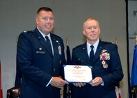 Colonel John Lipinski 615th Contingency Response Wing commander, left, poses  with Colonel Steven Jordon the outgoing   570th Contingency Response Group commander after presenting the Legion of Merit Medal to Colonel  Jordan during the 570th Contingency Response Group change of command ceremony. (U.S. Air Force photo by Civ/Nan Wylie) 