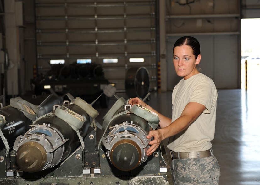 DYESS AIR FORCE BASE, Texas – Senior Airman Stacie Dow, 7th Aircraft Maintenance Squadron, inspects one of the B-1B, Lancer weapons at the Dyess load barn June 26. Along with loading weapons Airman Dow and her fellow weapons loaders must also inspect and perform safety measures to ensure all weapons will work properly. (U.S. Air Force photo by Senior Airman Jennifer Romig)