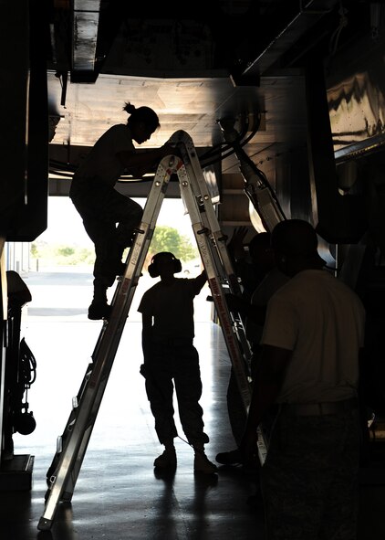 DYESS AIR FORCE BASE, Texas – Senior Airman Stacie Dow and Airman First Class Arien Abad, 7th Aircraft Maintenance Squadron, finish the last steps of their weapons loading evaluation at the Dyess load barn June 26 . During the evaluation, a team of four weapons Airmen downloaded a preloaded 28xMOD and then reuploaded. As the Airmen went through the steps, they made sure there were no errors so they could pass their evaluation the first time through.(U.S. Air Force photo by Senior Airman Jennifer Romig)