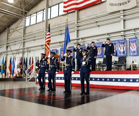 HURLBURT FIELD, Fla-- (from left to right) Col. Gregory Lengyel,1st Special Operations Wing commander, Col. Dennis Pannell, 1st Special Operations Group commander and Col. Albert "Buck" Elton, incoming 1 SOG commander salute the colors as they pass to begin the change of command ceremony at the 4th Aircraft Maintenance Unit hangar July 2. Colonel Elton assumed command of a group consisting of eight squadrons, more than 70 aircraft and more than 1,400 personnel (U.S. Air Force photo/Senior Airman Sheila DeVera). 