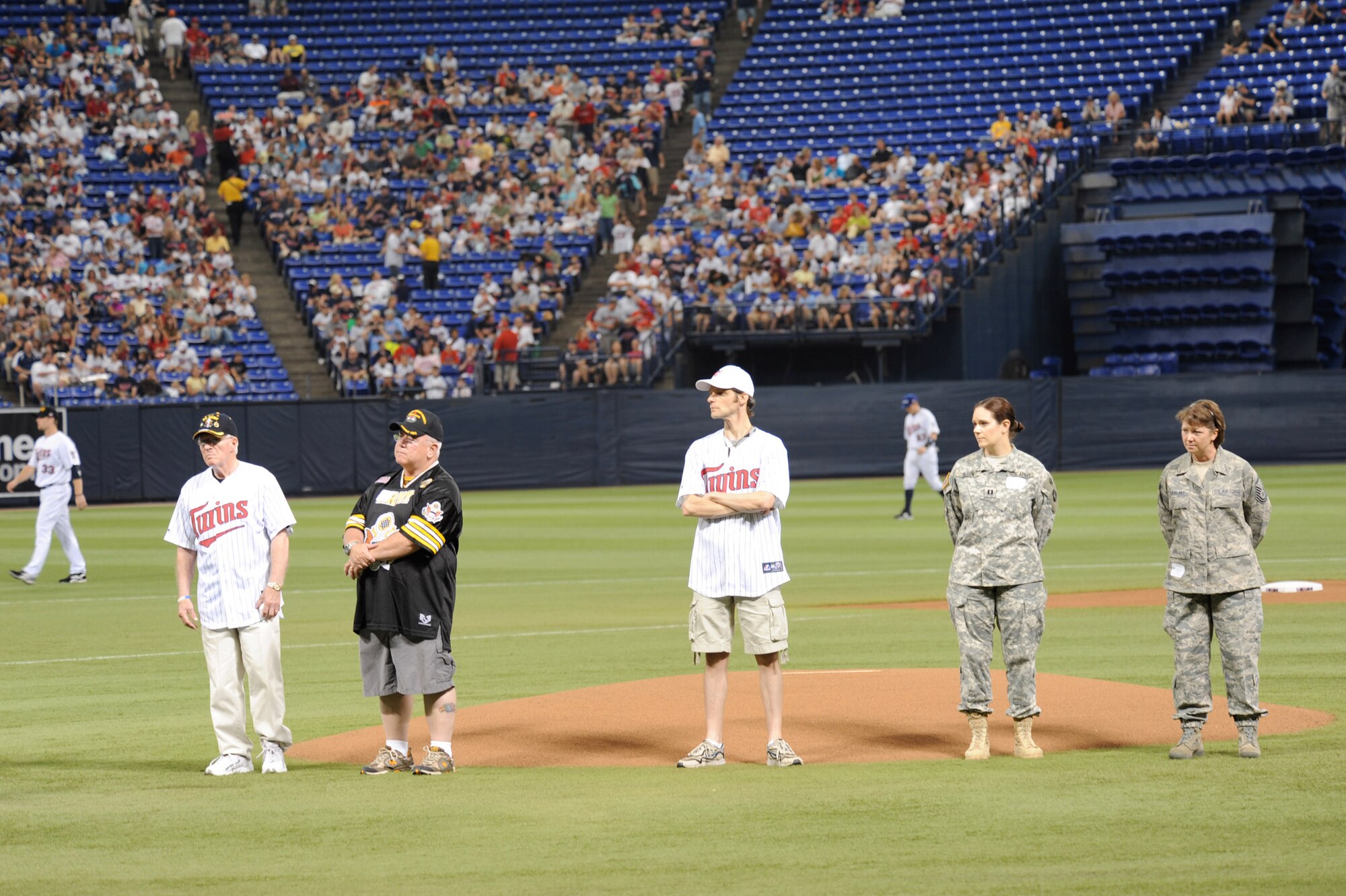The Minnesota Twins host the 7th Annual Armed Services Appreciation Day on July 5, 2009 at the Metrodome in Minneapolis, Minnesota. The pregame festivities included Freedom Flight and Liberty Belle hot air balloons, a performance by the United States Air Force Heartland of America Band "Night Wing" and ceremonial first pitches by veterans from conflicts dating back to World War II. During the game the Twins wore caps honoring the five branches of the Armed Services. All current and former members of the Armed Services and their families received four complimentary tickets to the game.
United States Air Force photo by Tech. Sgt. Erik Gudmundson (Released)

