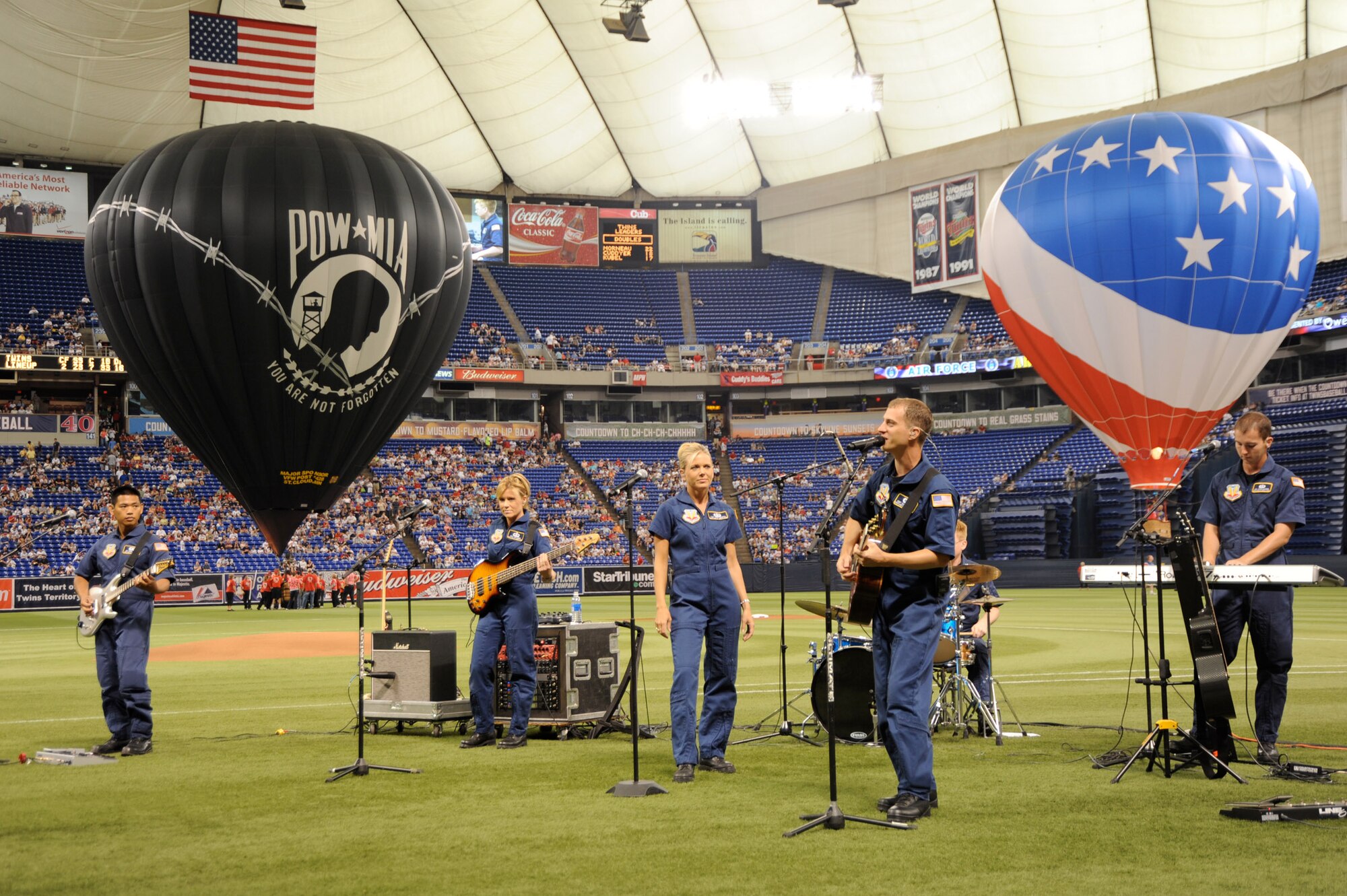 The Minnesota Twins host the 7th Annual Armed Services Appreciation Day on July 5, 2009 at the Metrodome in Minneapolis, Minnesota. The pregame festivities included Freedom Flight and Liberty Belle hot air balloons, a performance by the United States Air Force Heartland of America Band "Night Wing" and ceremonial first pitches by veterans from conflicts dating back to World War II. During the game the Twins wore caps honoring the five branches of the Armed Services. All current and former members of the Armed Services and their families received four complimentary tickets to the game.
United States Air Force photo by Tech. Sgt. Erik Gudmundson (Released)
