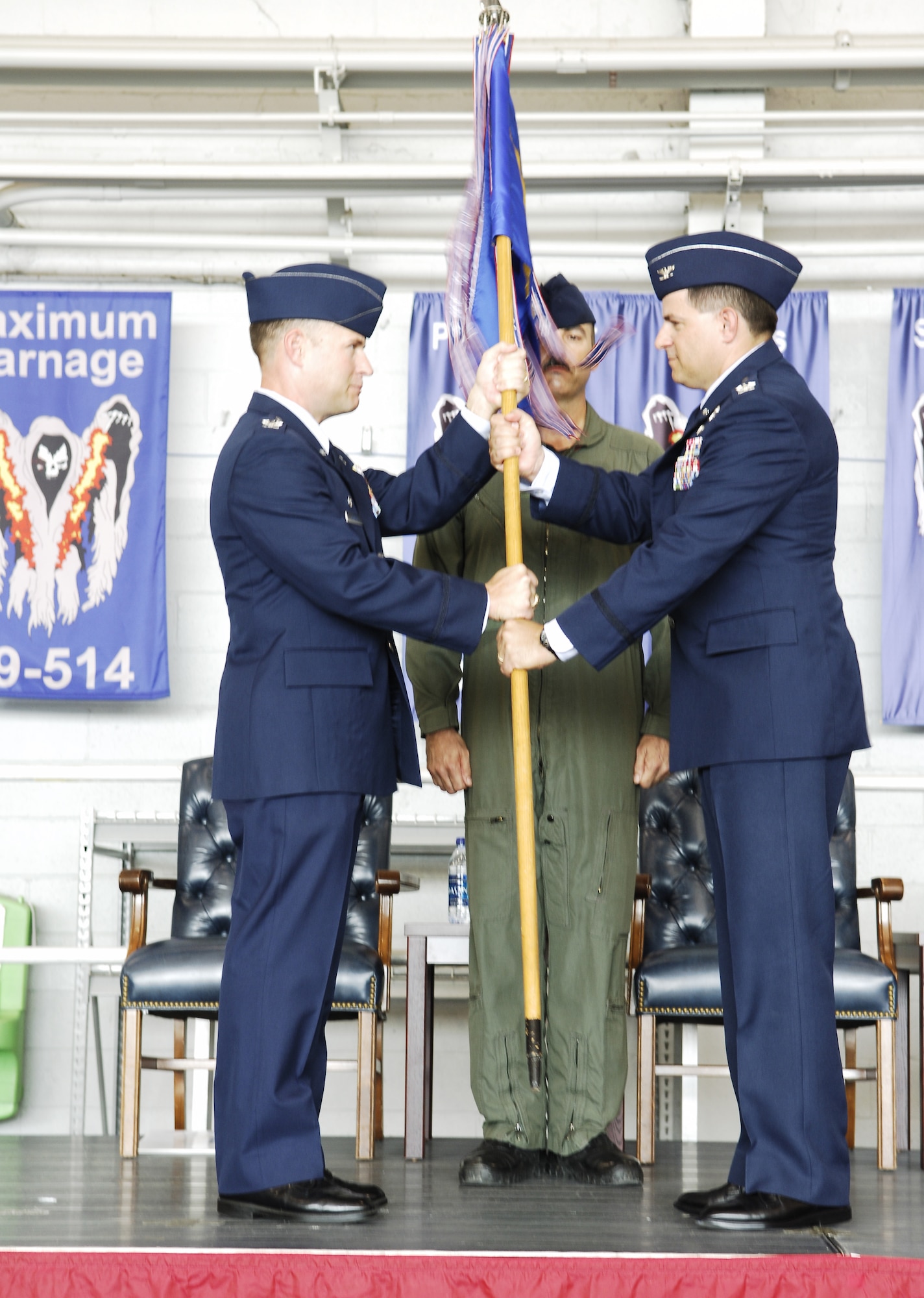 Col. Albert "Buck" Elton receives the 1st Special Operations Group guidon from Col. Gregory Lengyel July 2. Col. Elton assumed command of the 1 SOG from Col. Dennis Pannell (U.S. Air Force photo/Senior Airman Sheila DeVera).