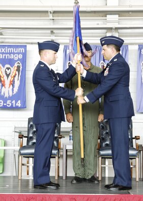 HURLBURT FIELD, Fla.-- Col. Albert "Buck" Elton (right) receives the 1st Special Operations Group guidon from Col. Gregory Lengyel July 2. Col. Elton assumed command of the 1 SOG from Col. Dennis Pannell (U.S. Air Force photo/Senior Airman Sheila DeVera). 