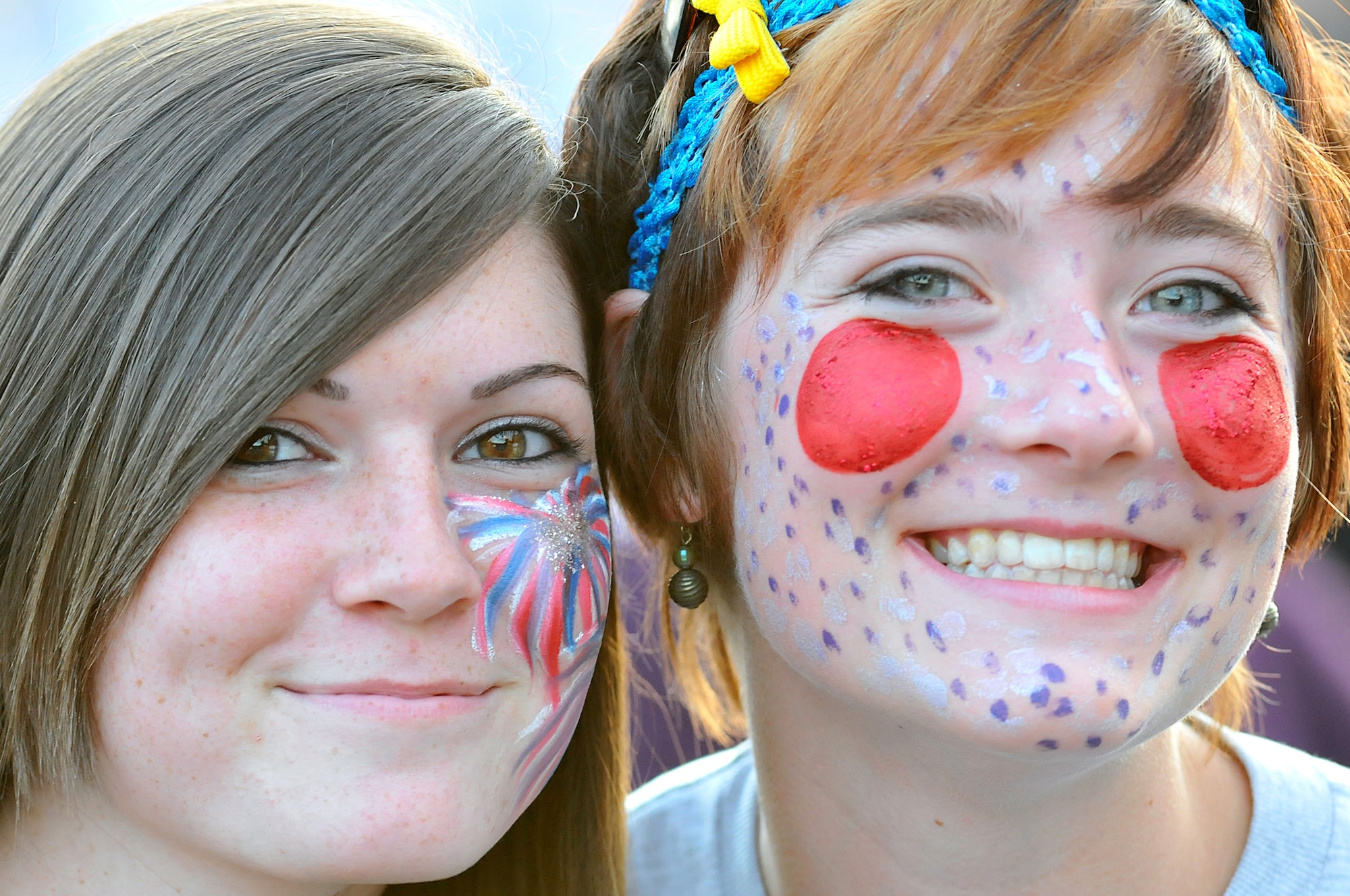 Laura Bailes and Christy Williams, military family members, enjoy festivities at the Rockin' Fourth of July celebration, July 4, 2009, Kapaun Air Station, Germany. Kaiserslautern Military Community members celebrated the event with games, rides and concerts and ended the night with fireworks. (U.S. Air Force photo by Staff Sgt. Stephen J. Otero)