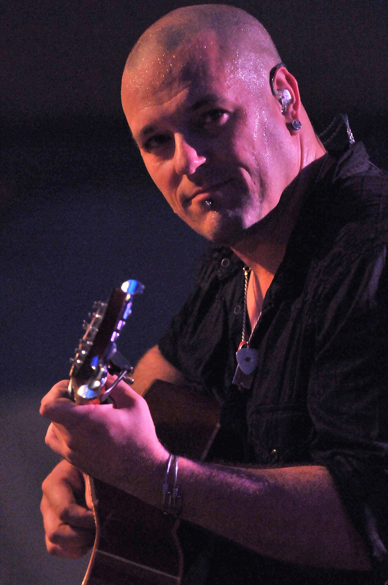 C.B. Hudson, lead guitarist of the band Blue October, plays at the Rockin' Fourth of July celebration, July 4, 2009, Kapaun Air Station, Germany. Kaiserslautern Military Community members celebrated the event with games, rides and concerts and ended the night with fireworks. (U.S. Air Force photo by Staff Sgt. Stephen J. Otero)