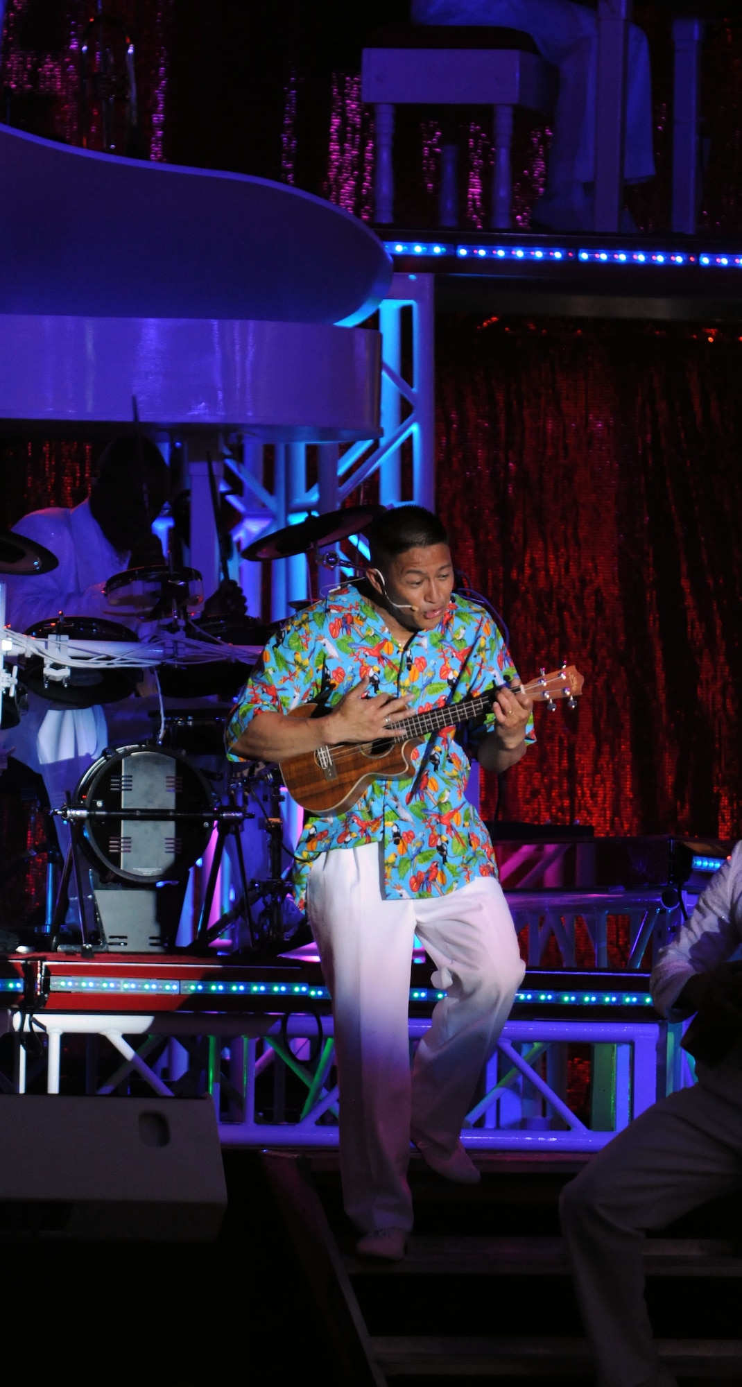 Master Sgt. Herbert Ancog, Tops in Blue vocalist, sings “Over the Rainbow” during the group’s July 4 performance at RAF Feltwell.  The travelling show included hits from almost every genre, including country, jazz, rock and pop.  (U.S. Air Force photo by Staff Sgt. Austin M. May)