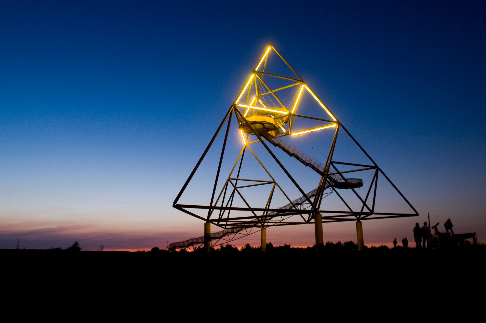 SPANGDAHLEM AIR BASE, Germany -- The Tetraeder in Bottrop, Germany, is a man-made tetrahedron built by the architect Wolfgang Christ in 1995. The Tetraeder has stairs and an observation deck that looks out at the surrounding area of Essen and Bottrop. At night, the structure is illuminated and is an important landmark in Nordrhein-Westfalen. (U.S. Air Force photo by Airman 1st Class Nathanael Callon)