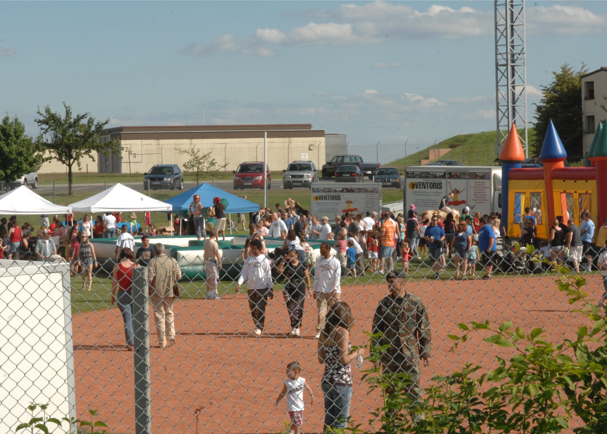 SPANGDAHLEM AIR BASE, Germany -- 52nd Fighter Wing Sabers celebrate Independence Day during Spangdahlem Air Base’s Super Saber Day July 4.  Approximately 1,800 Sabers enjoyed 3,100 free meals served, music by the Wild Bobbin’ Baboons and The Blind Dog, a dunk tank, various activity booths, and a fireworks display finale.  (U.S. Air Force photo by Senior Airman Jenifer H. Calhoun)