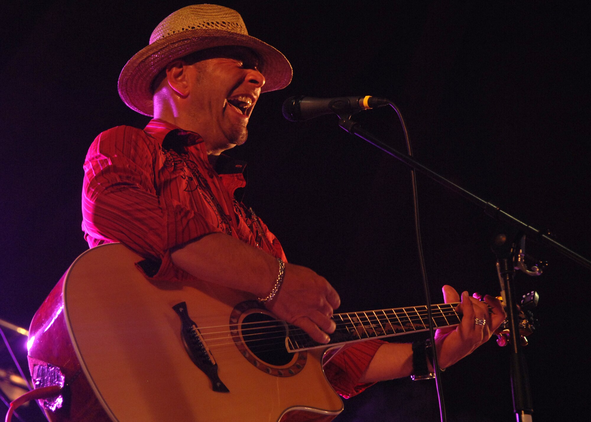 SPANGDAHLEM AIR BASE, Germany -- Fäb Michels, guitar player and vocalist for the classic rock band The Blind Dog, plays July 4 during Spangdahlem Air Base’s Super Saber Day.  In addition to live bands, the event included various activity booths, free food, a pet show and a fireworks finale.  (U.S. Air Force photo by Staff Sgt. Logan Tuttle)