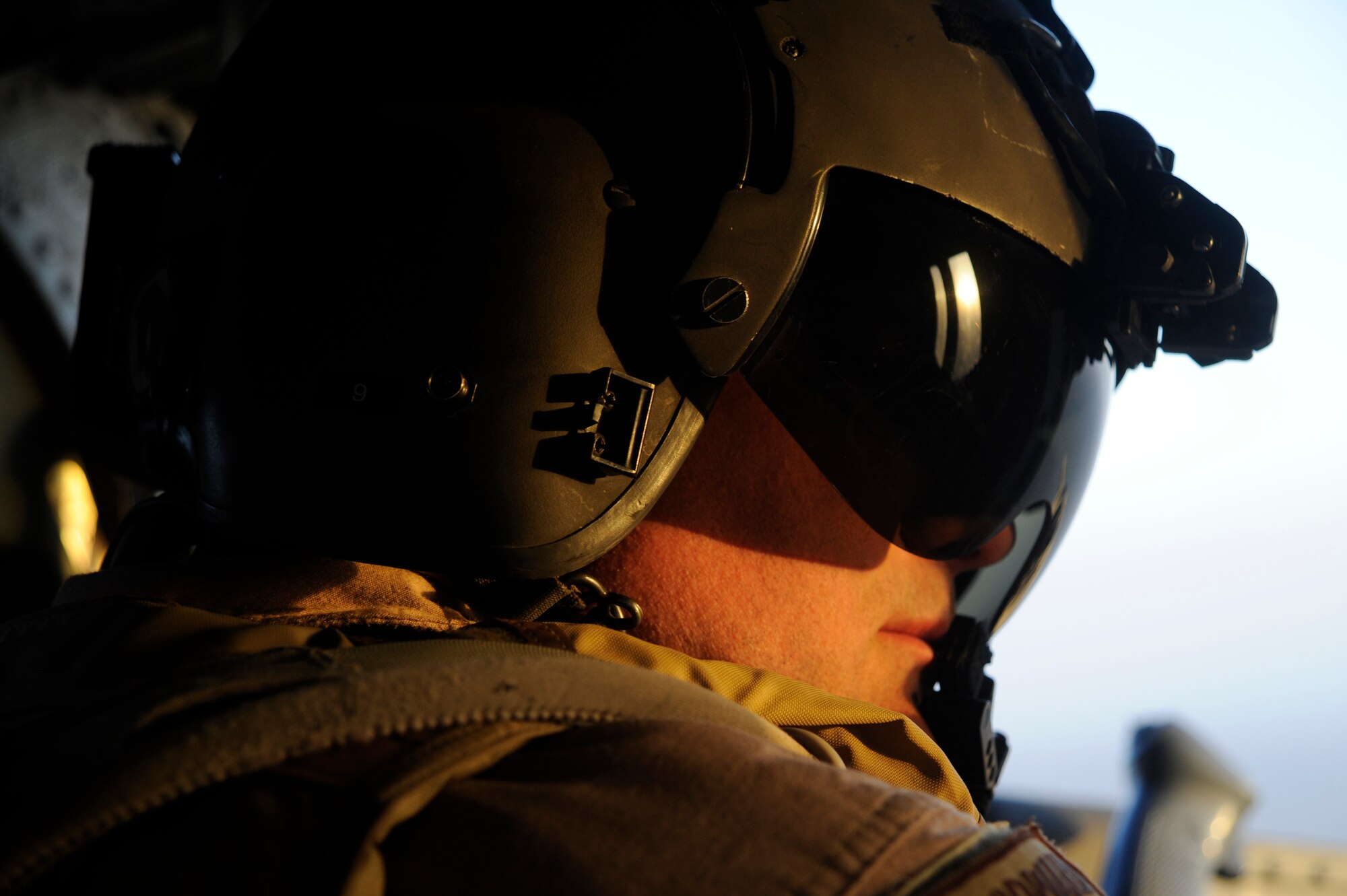 U.S. Air Force Technical Sgt. Brock Woodward, flight engineer with the 129th Expeditionary Rescue Squadron, provides security during combat operations June 23, 2009, Hemland Province, Afghanistan. (U.S. Air Force Staff Sgt. Shawn Weismiller)