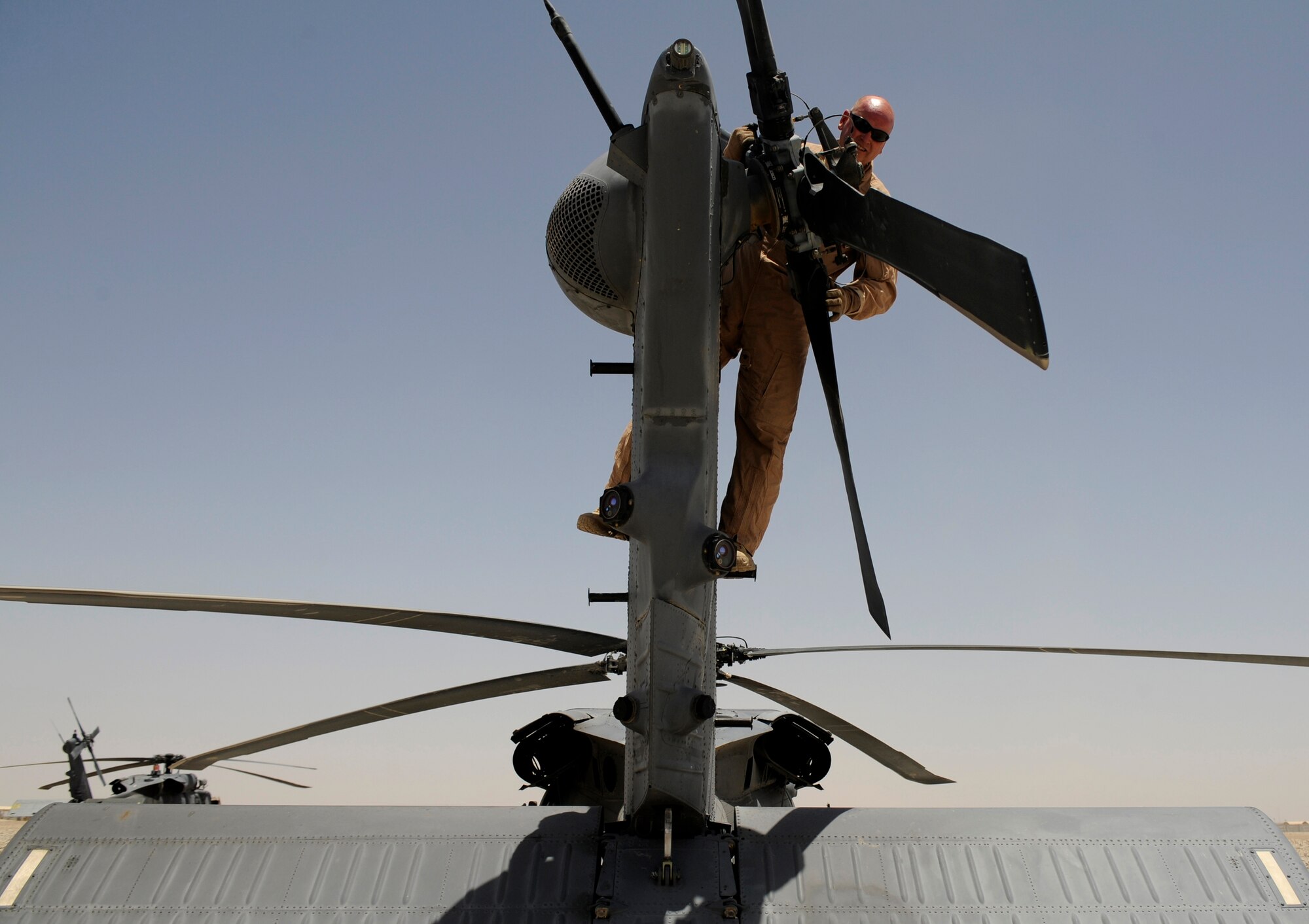 U.S. Air Force Master Sgt. James Patterson, flight engineer with the 129th Expeditionary Rescue Squadron, performes a preflight inspection of a HH-60G Pave Hawk, June 23, 2009, Camp Bastion, Afghanistan. (U.S. Air Force Staff Sgt. Shawn Weismiller)