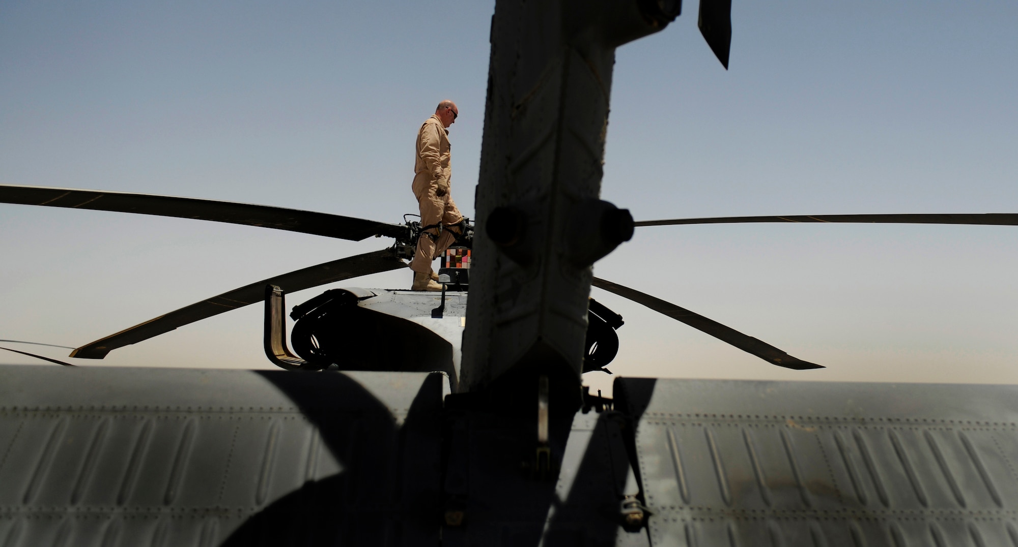 U.S. Air Force Master Sgt. James Patterson, flight engineer with the 129th Expeditionary Rescue Squadron, performes a preflight inspection of a HH-60G Pave Hawk, June 23, 2009, Camp Bastion, Afghanistan. (U.S. Air Force Staff Sgt. Shawn Weismiller)