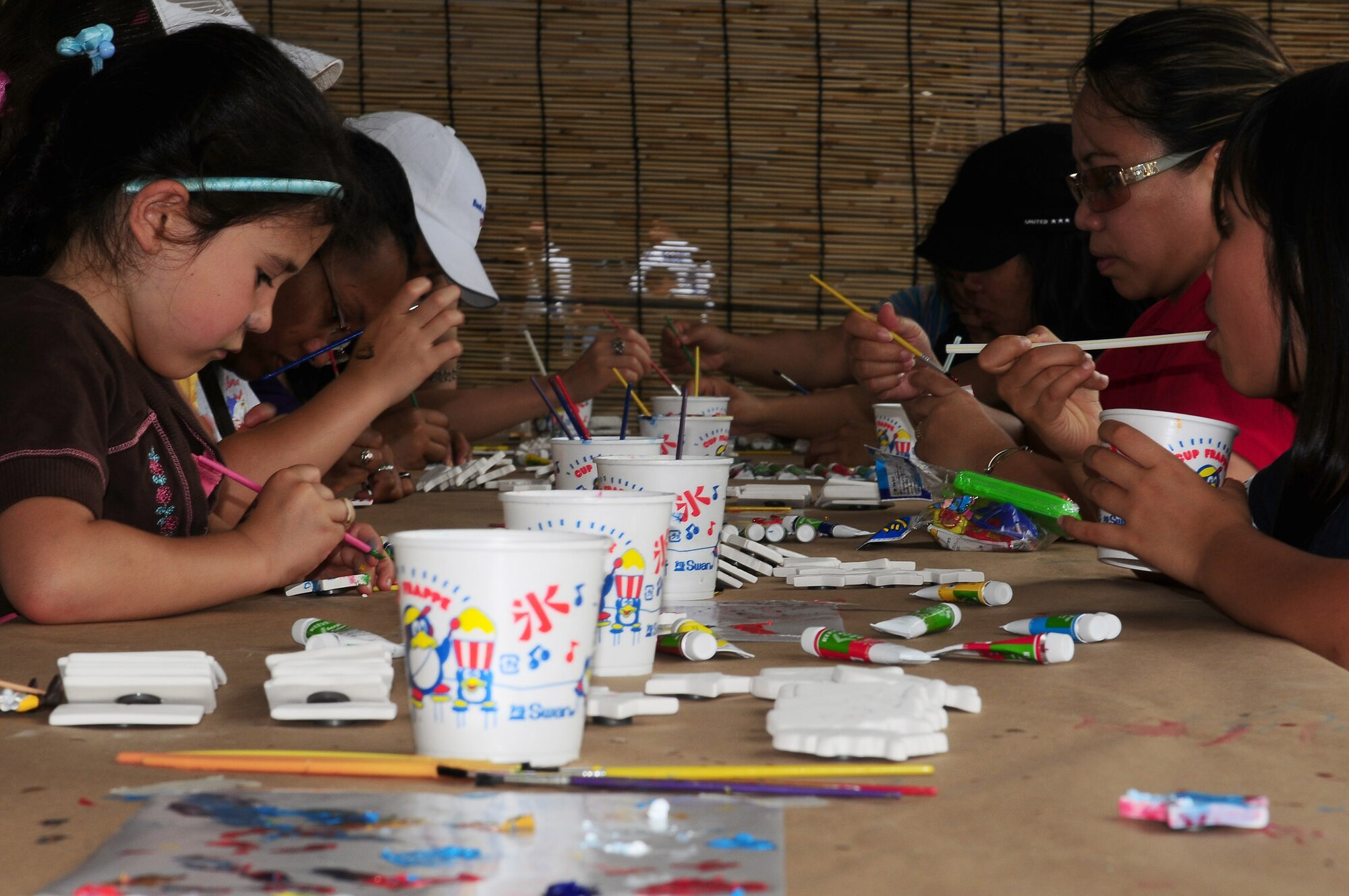 YOKOTA AIR BASE, Japan -- Team Yokota family and friends paint ceramic magnets at the Celebrate America fourth of July festival. (U.S. Air Force photo/Airman First Class Devin Doskey) 