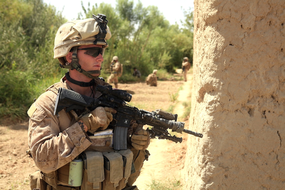 U.S. Marine Corps Cpl. Matthew Miller maintains security during an operation in Helmand province, Afghanistan, July 3, 2009. Miller is a rifleman assigned to the 2nd Battalion, 8th Marine Regiment.