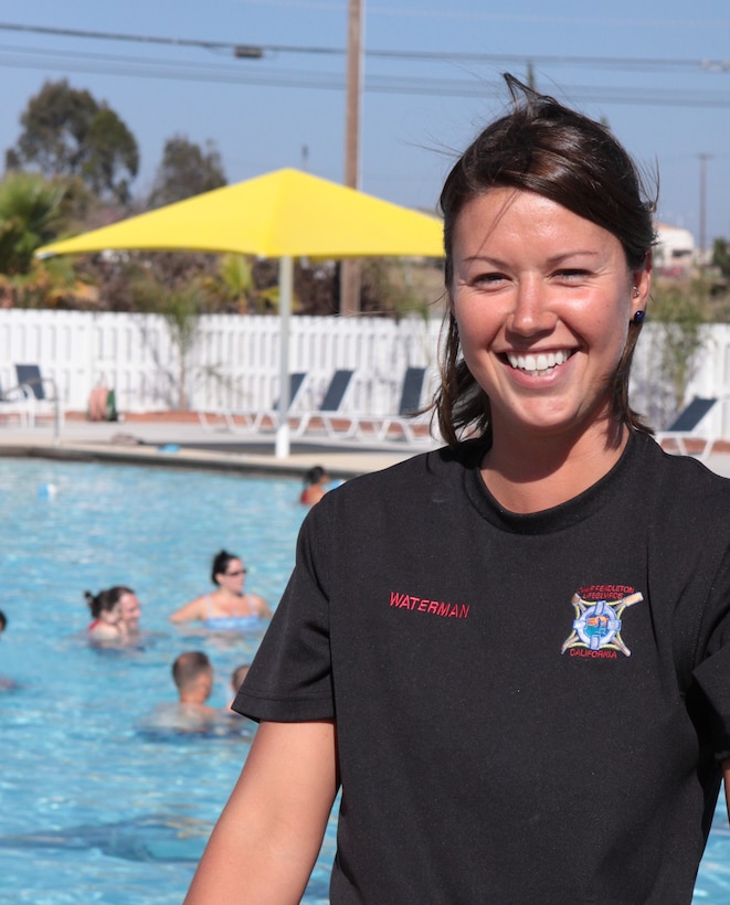 Laura R. Waterman, lifeguard supervisor, 13 Area Pool, directs the annual summer swim lessons July 7, the annual event helps teach a range of skills including water safety, proper swimming techniques and fitness.