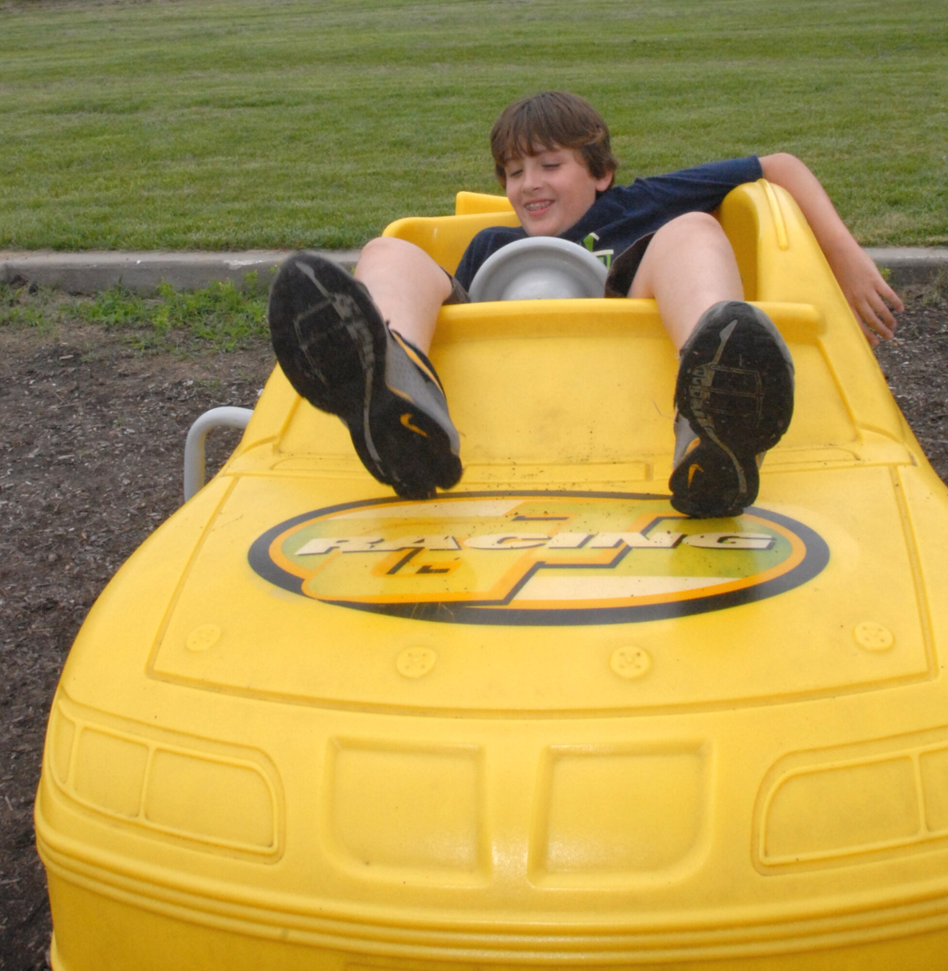 WHITEMAN AIR FORCE BASE, Mo. - One family member finds out he’s just a little bigger than he thought when he sits in a car at the playground during the 442nd Fighter Wing’s family-day picnic June 13. The 442nd Fighter Wing is an Air Force Reserve unit based here at Whiteman. (U.S. Air Force photo/Master Sgt. William Huntington)