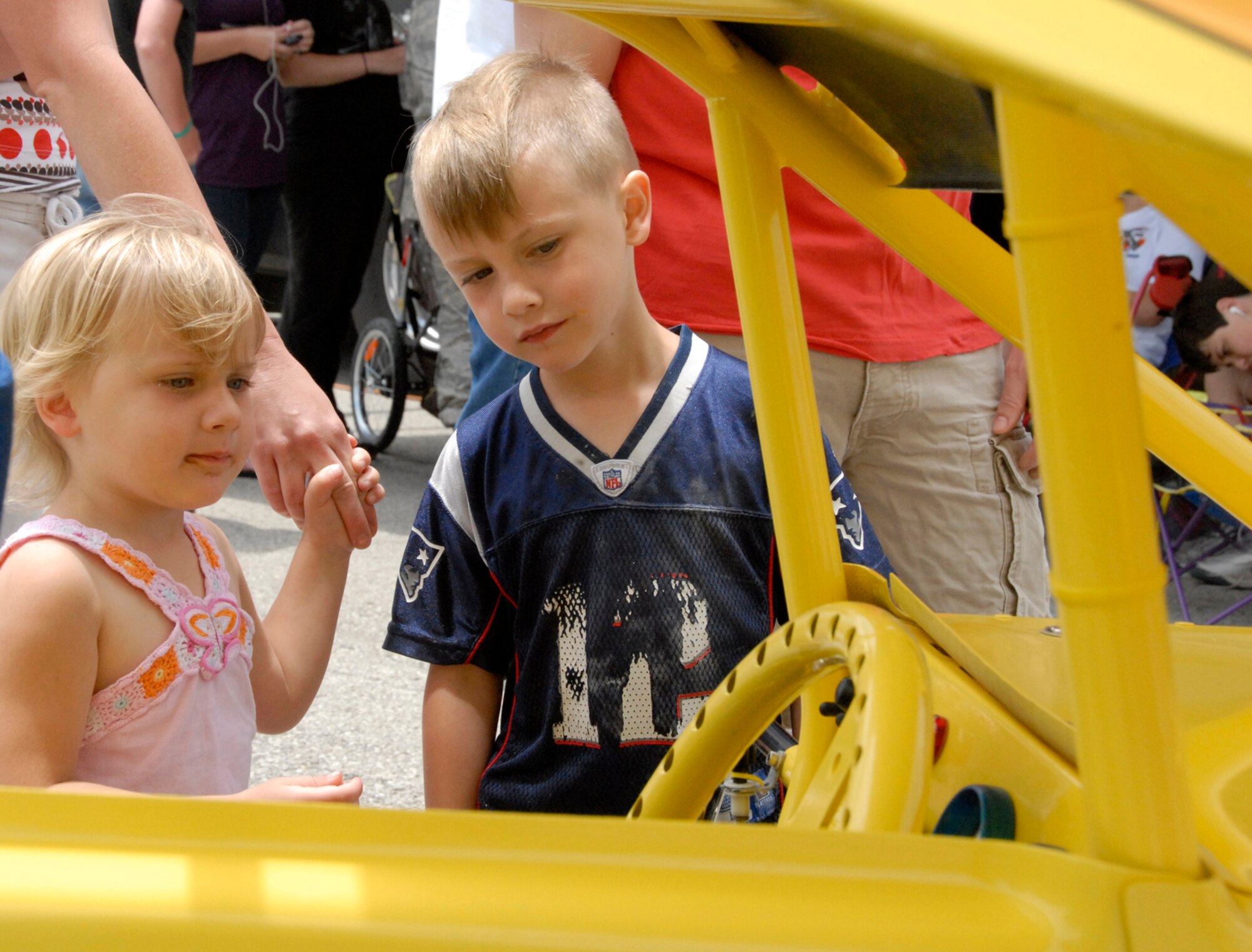 WHITEMAN AIR FORCE BASE, Mo. - Young family members admire the Micro Sprint car owned by Tech. Sgt. Pete Melby's family. Sergeant Melby is an Air Force reservist in the 442nd Aircraft Maintenance Squadron, part of the 442nd Fighter Wing, an Air Force Reserve unit based at Whiteman. (U.S. Air Force photo/Senior Airman Danielle Wolf)
