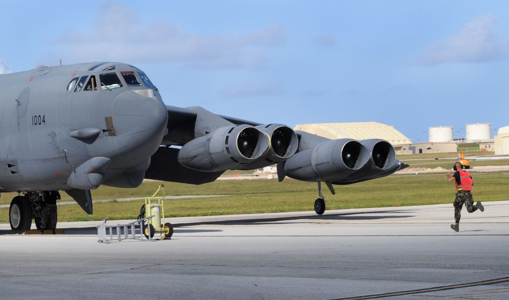 Airman 1st Class Justin Hamby, 2nd Expeditionary Aircraft Maintenance Unit
crew chief, runs toward a B-52 Stratofortress bomber after it lands at
Andersen Air Force Base, Guam.  The B-52, deployed from Barksdale
AFB, La., returned here after particpating in Northern Edge 2009, an exercise that focuses on tactical-level execution of U.S. Pacific Command training objectives in a joint environment, June 15-26. The B-52 bombers are here in support of
the U.S. Pacific Command's Continuous Bomber Presence in the Asia-Pacific
Region. (U.S. Air Force photo/ Senior Airman Christopher Bush)
