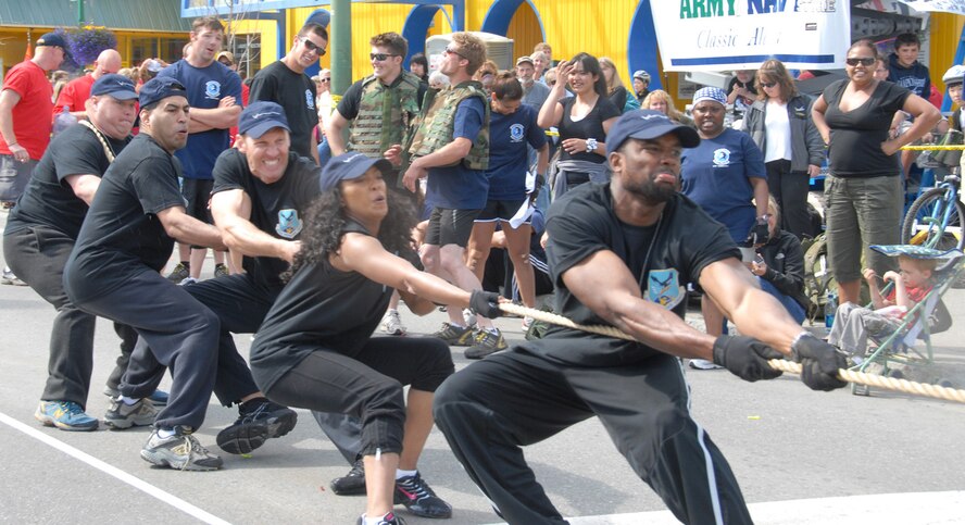 The Double Deuces, the five-person team from Air Force Reserve Command’s 477th Fighter Group, participated in the first-ever Hero Games in downtown Anchorage, Alaska, June 27. The games were part of Alaska’s 50th Anniversary Celebration and sponsored by the Anchorage Downtown Partnership. The games pitted military members, including Reserve, active duty and Guard, against firefighters, police officers and other local first responders. Events included an obstacle course, water balloon volleyball, tricycle race, tug-of-war, litter carry, and a bucket brigade vehicle tow. From left: Lt. Col. Dave "Piff" Piffarerio, Tech. Sgt. Jorge "The Hellion" Mendoza, Staff Sgt. Spencer "The Guns" Walcott, and Staff Sgt. Danielle "La Femme Fatale" Foster. Out of 12 teams, the Super Guardians from the Air National Guard took first and the Anchorage Fire Department took second. The Double Deuces took fourth. (U.S. Air Force photo/Staff Sgt. Andrea Knudson)