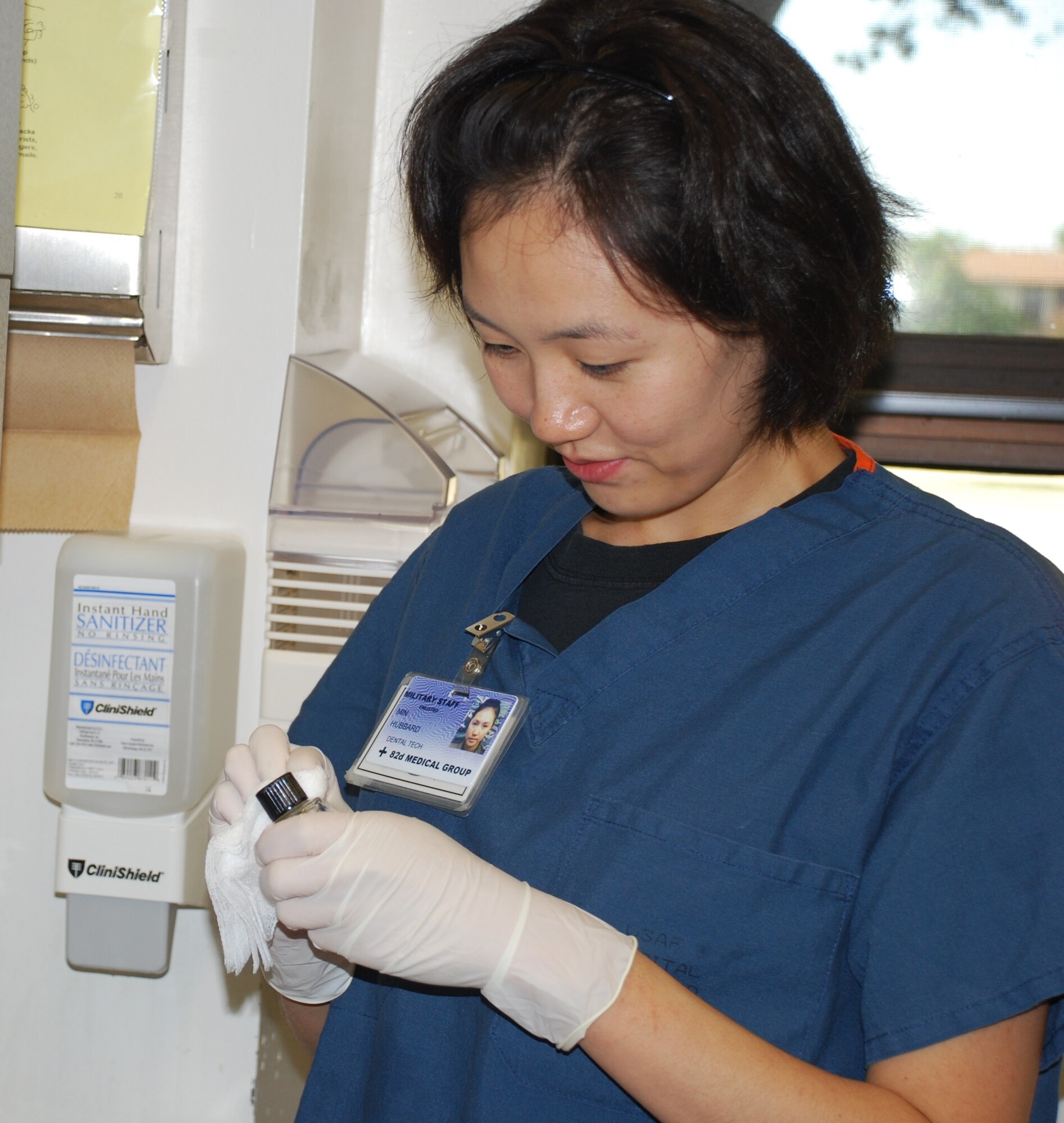 Airman Min J Hubbard, a dental technician at the 82nd Dental Squadron, cleans her dental treatment room after seeing a patient at the dental clinic July 8. Dental assistants attend technical training for more than nine weeks. (U.S. Air Force photo/ Airman 1st Class Valerie Hosea)