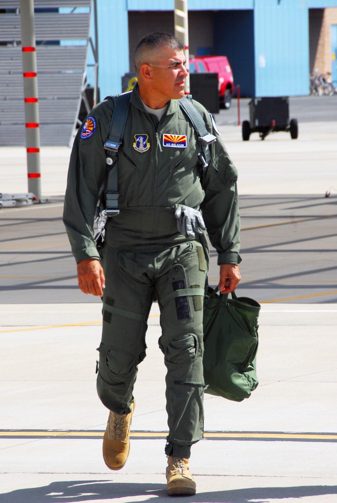Army Maj. Gen. Hugo E. Salazar, Adjutant General and Commanding General of the Arizona National Guard, walks out to an F-16D Fighting Falcon for a flight at the 162nd Fighter Wing, July 7. The experience was instrumental in familiarizing General Salazar with the wing's full-time mission to train U.S. and partner nation fighter pilots. (Air National Guard photo by Master Sgt. Dave Neve)