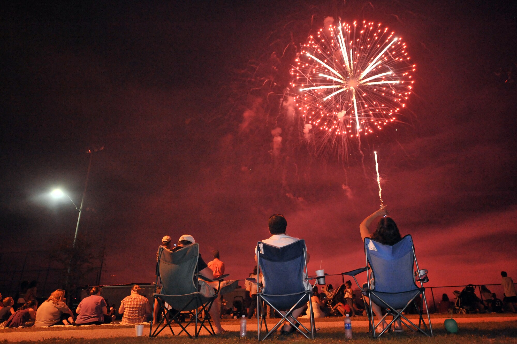 Sumter, S.C. -- Sumter locals watch the fireworks display at the end of the Jammin' July 4th celebration. The Sumter and Shaw Air Force Base communities come together every year for music and a fireworks show. Shaw helps sponsor the event every year to give back to its host community. (U.S. Air Force photo/Senior Airman Kathrine McDowell)
