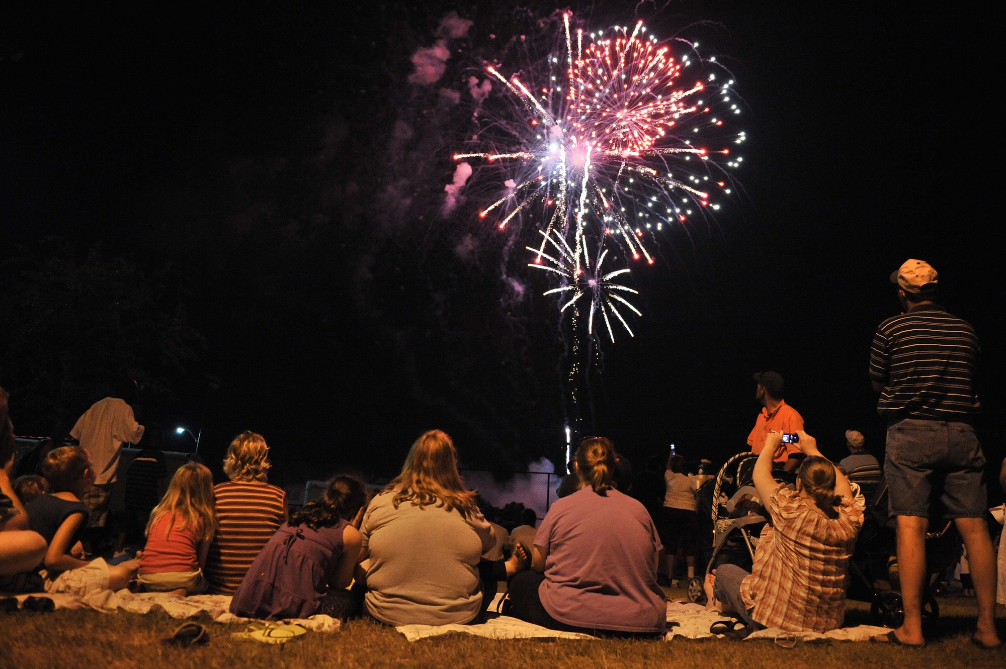 Sumter, S.C. -- Sumter locals watch the fireworks display at the end of the Jammin' July 4th celebration. The Sumter and Shaw Air Force Base communities come together every year for music and a fireworks show. Shaw helps sponsor the event every year to give back to its host community. (U.S. Air Force photo/Senior Airman Kathrine McDowell)

