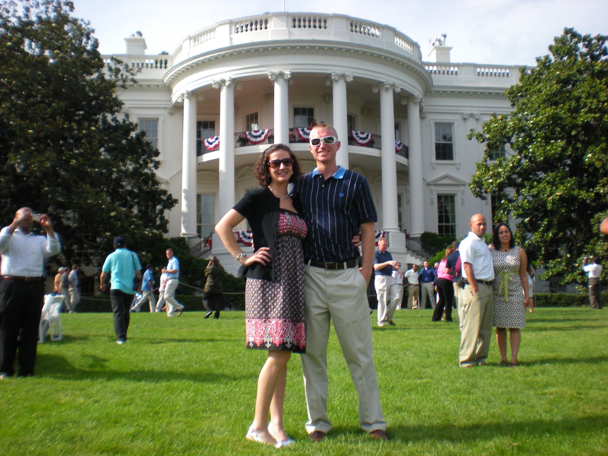 Stacy and Staff Sgt. Stephen Hart, 436th Maintenance Operations Squadron Qualification Training Program instructor, pose for a photo on the White House South Lawn during a Independence Day celebration July 4. The couple was among more than 70 Airmen and their families who got the opportunity to partake in the 4th of July celebration with President Barack Obama. (Courtesy photo)