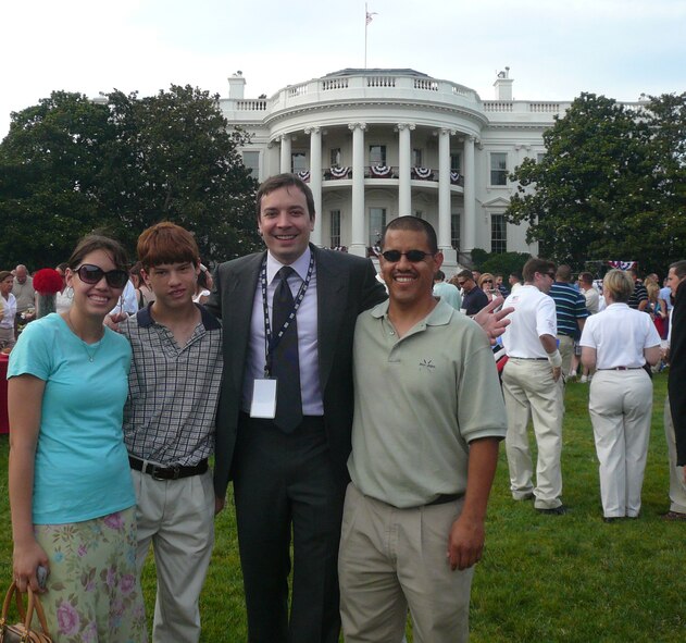 (Left to right) Brittany and Sean Infante, children of Tech. Sgt. Antonio Infante, 436th Airlift Wing Legal Office Military Justice NCO-in charge, celebrity Jimmy Fallon, and Sergeant Infante pose for a photo on the White House South Lawn during an Independence Day celebration July 4. Sergeant Infante described Mr. Fallon as a down-to-earth guy who really took an interest in the servicemembers and their families. (Courtesy photo)