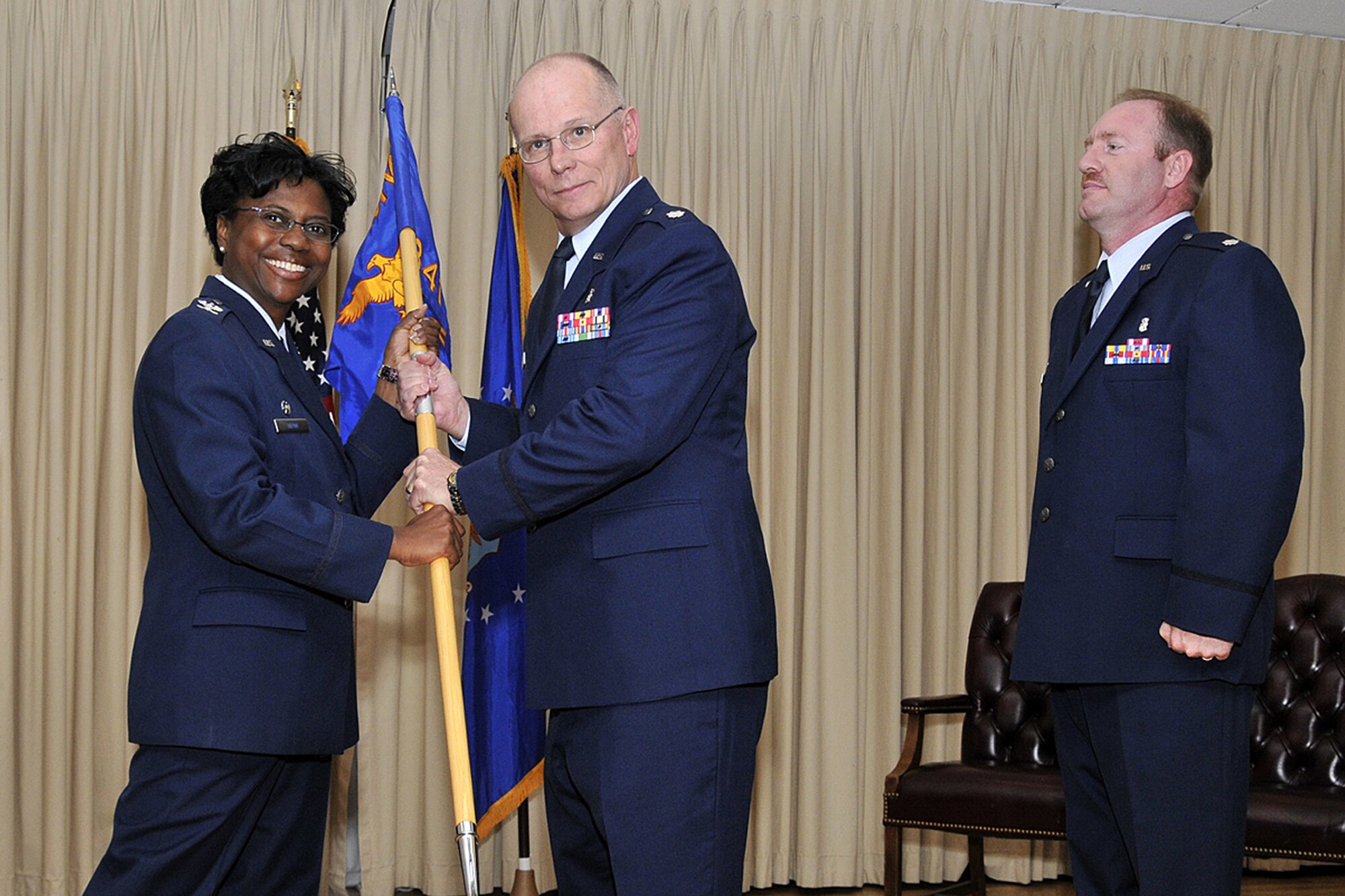 Lt. Col. Keith Cunningham, center, accepts command of the 341st Medical Support Squadron from Col. Leslie Dixon, 341st Medical Group commander, June 26 at the Grizzly Bend Club. Lt. Col. Duane Bragg, outgoing 341st MDSS commander, looks on.