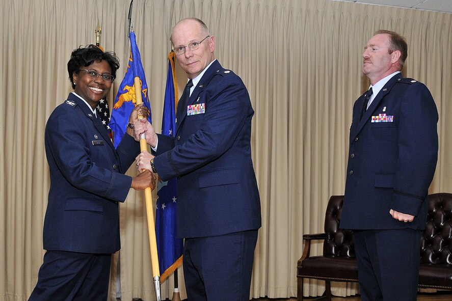 Lt. Col. Keith Cunningham, center, accepts command of the 341st Medical Support Squadron from Col. Leslie Dixon, 341st Medical Group commander, June 26 at the Grizzly Bend Club. Lt. Col. Duane Bragg, outgoing 341st MDSS commander, looks on.