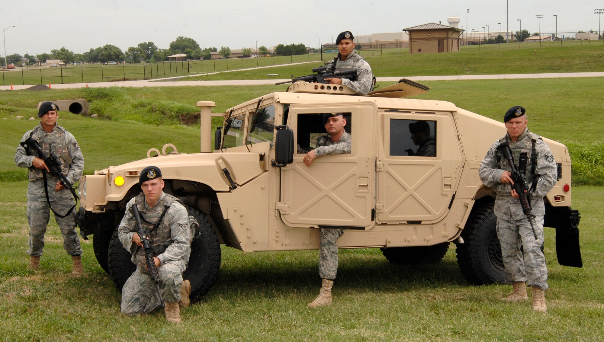 MCCONNELL AIR FORCE BASE, Kan. -- Members from the 2009 Rodeo Security Forces team, to the far left is Staff Sgt. Benjamin Rausch and by the door is Airman 1st Class Eric Hargarten 22nd Security Forces Squadron.  Above: Airman 1st Class Melvin Santos, 22nd Security Forces Squadron and kneeling is Senior Airman Charlina Shelley, 931st Security Forces. To the far right is Staff Sgt. Ryan Overcash, 22nd Security Forces Squadron. (Photo by Senior Airman Laura Suttles)