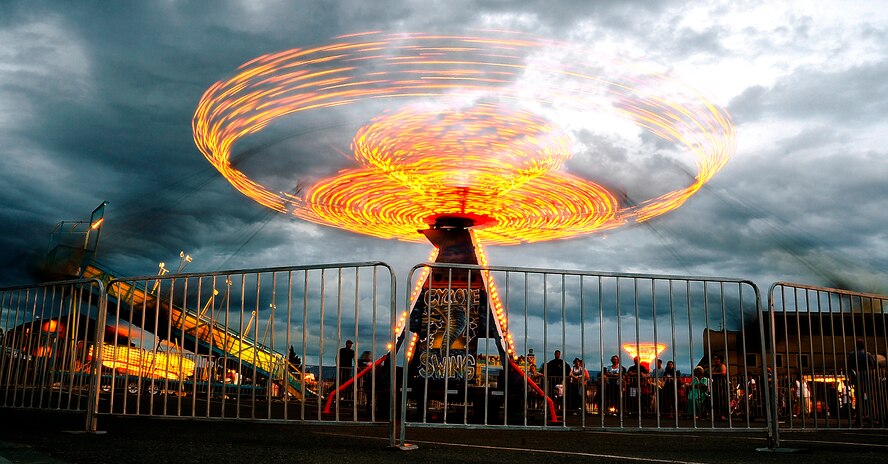 Carnival lights spin during the Fourth of July celebrations at Holloman Air Force Base, N.M., July 4. (U.S. Air Force Photo/Tech.Sgt. Chris Flahive)