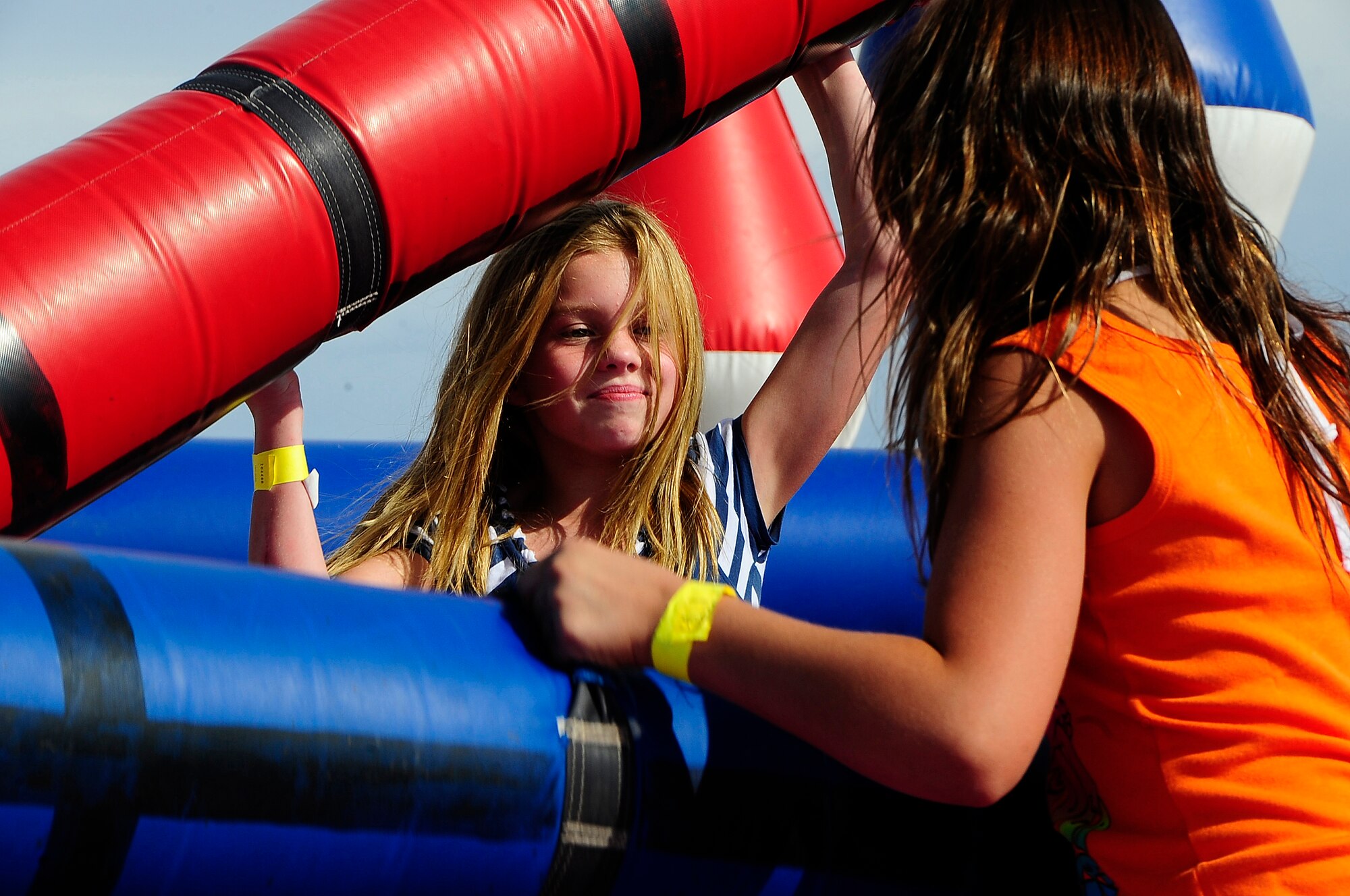 Sophie Lamn jousts with a friend at the Sports and Fitness Center during the Fourth of July Celebration at Holloman Air Force Base, N.M. (U.S. Air Force Photo/Tech.Sgt. Chris Flahive)