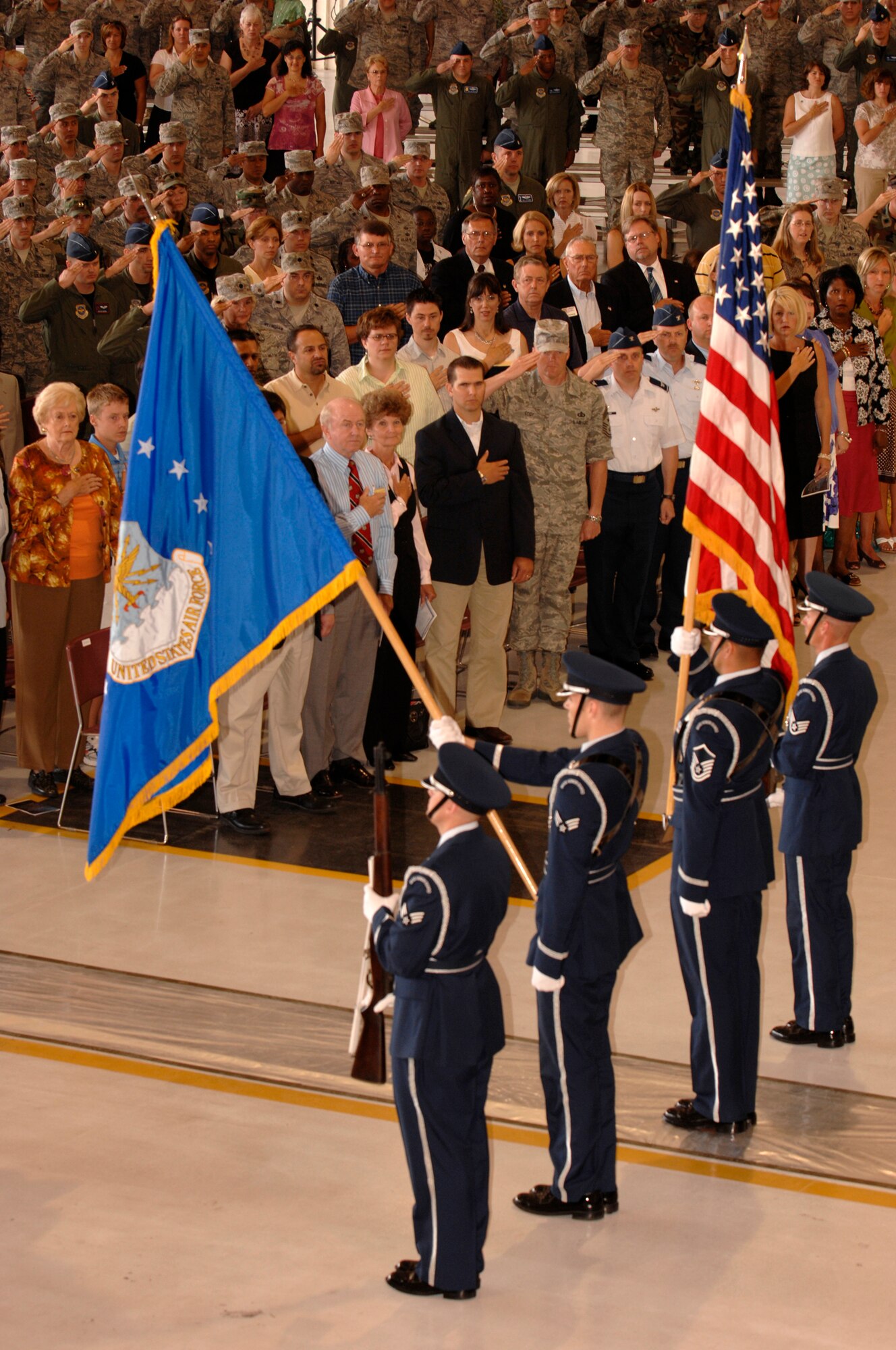MCCONNELL AIR FORCE BASE, Kan. -- A four person honor guard team led by Master Sgt. Edgar Salazar-Aguirre, 184th Services Flight, posts the colors in hangar 1176 during a change of command ceremony, July 2. The ceremony recognized Col. James W. Crowhurst as the new 22nd Air Refueling Wing commander. (Photo by Senior Airman Laura Suttles)