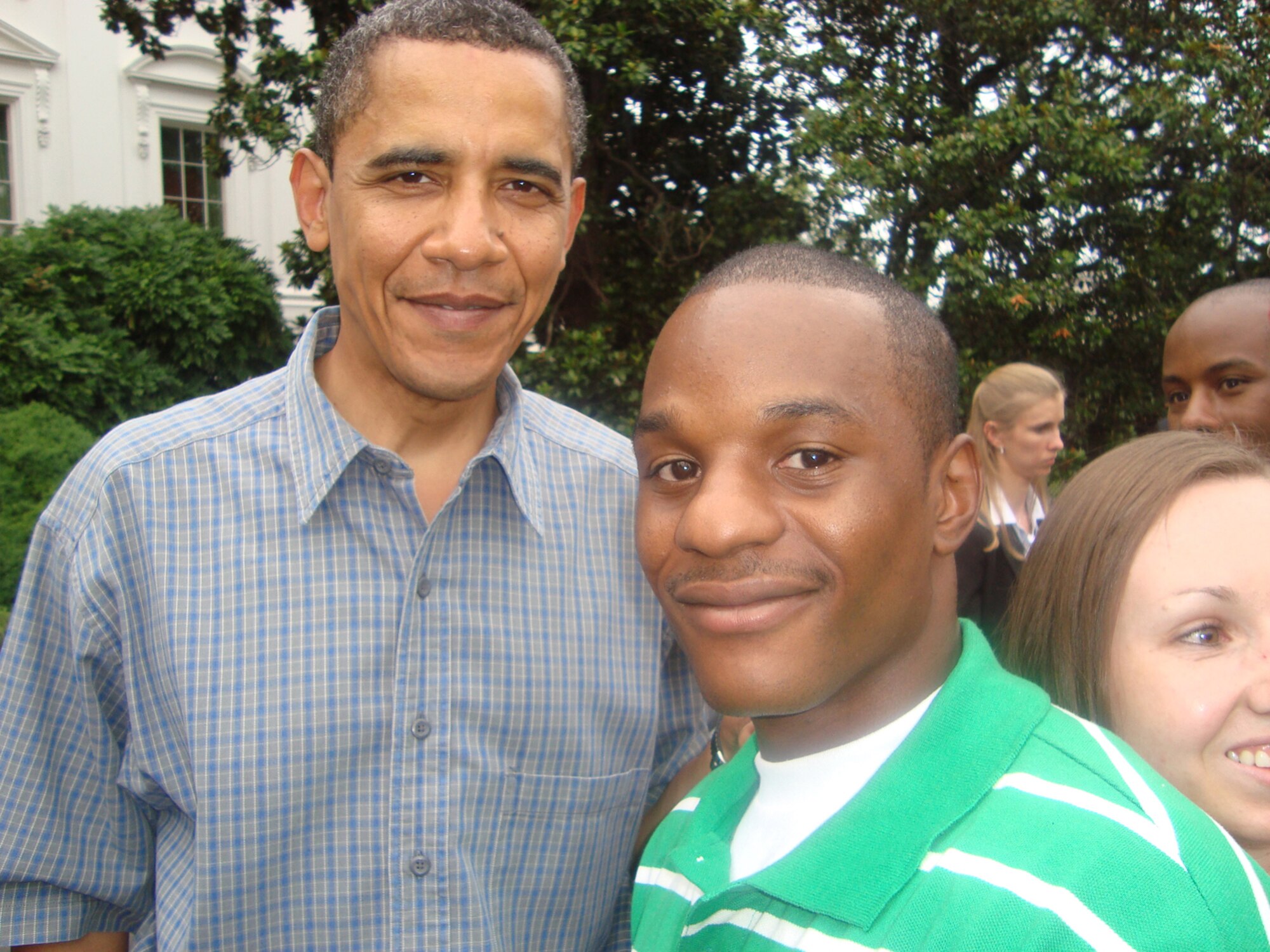 Senior Airman Duane Dunlap (right) visits with U.S. President Barack Obama during a Salute to the Military event at the White House on July 4.  Airman Dunlap, a Security Forces journeyman assigned to the 59th Patient Squadron at Lackland Air Force Base, Texas, was one of five Airmen chosen to attend the event that included dinner, fireworks and a chance to meet U.S. President and Mrs. Barack Obama. (U.S. Air Force photo/Staff Sgt. Theda Franklin)                                        