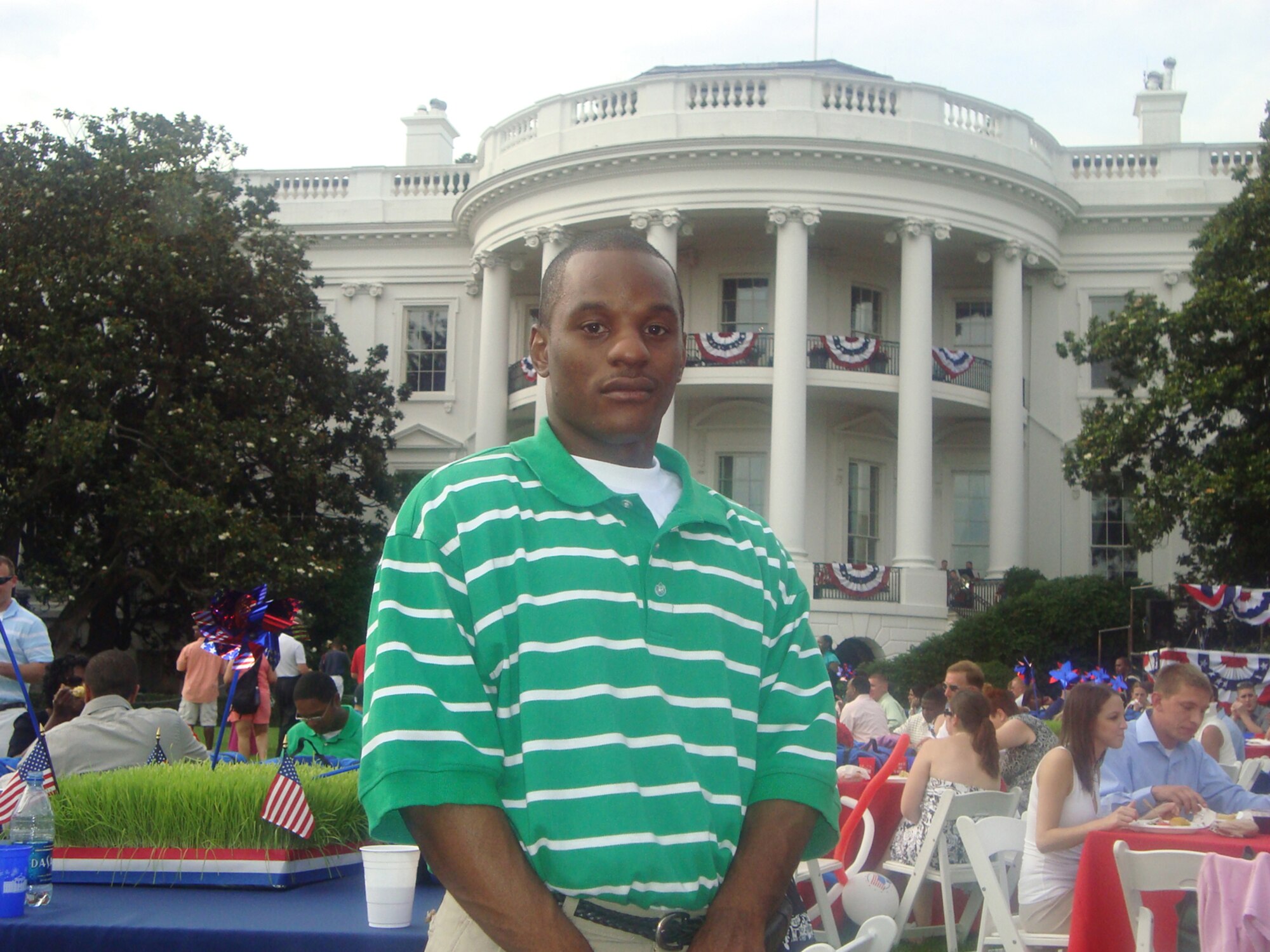 Senior Airman Duane Dunlap enjoys a Salute to the Military event at the White House on July 4.  Airman Dunlap, a Security Forces journeyman assigned to the 59th Patient Squadron at Lackland Air Force Base, Texas, was one of five Airmen chosen to attend the event that included dinner, fireworks and a chance to meet U.S. President and Mrs. Barack Obama. (U.S. Air Force photo/Staff Sgt. Theda Franklin)            