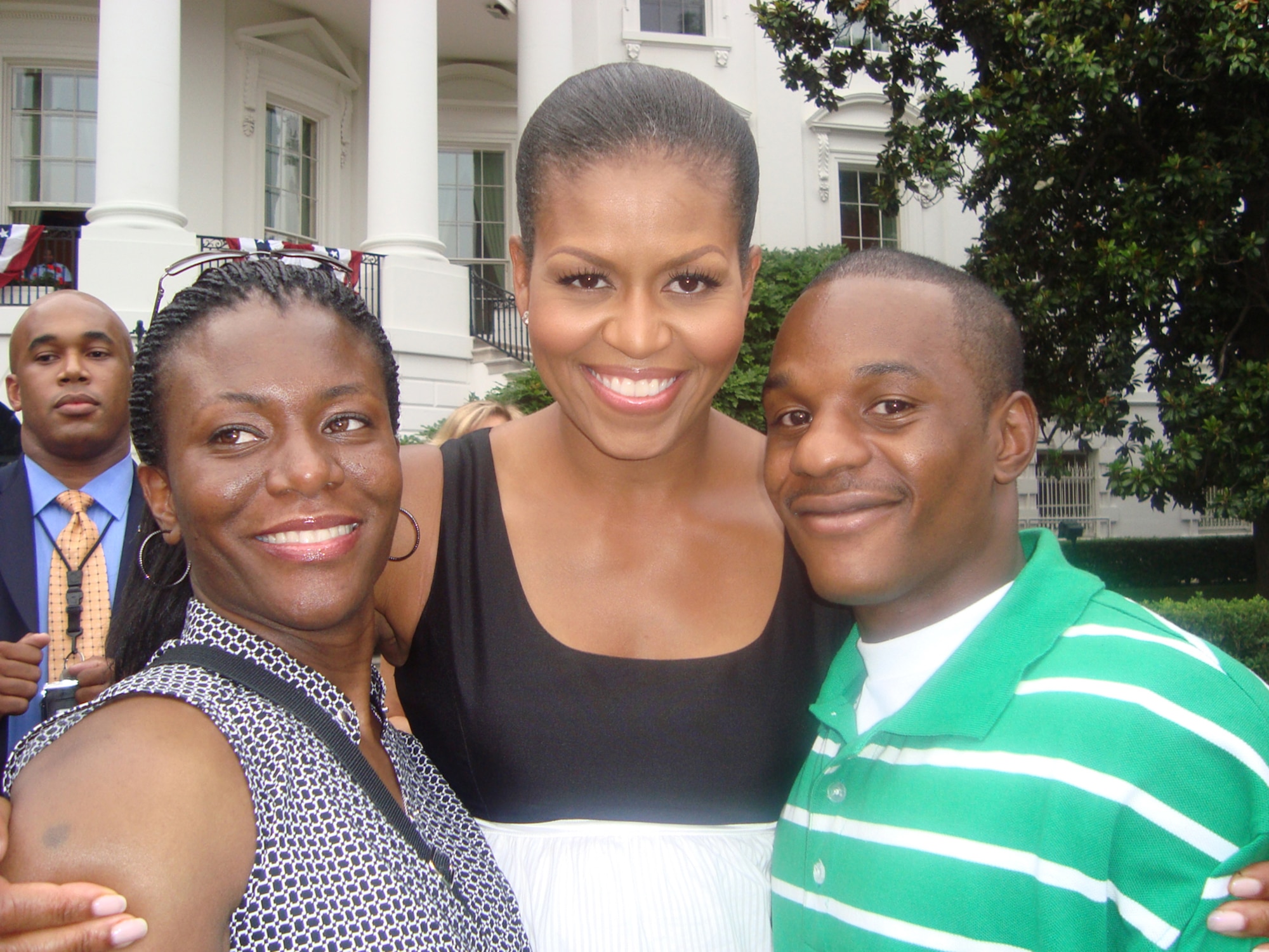 Senior Airman Duane Dunlap (right) and Staff Sgt. Theda Franklin (left), 59th Medical Wing, Lackland Air Force Base, Texas, visit with Mrs. Michelle Obama at the White House during a Salute to the Military event on July 4. Airman Dunlap is an Air Force wounded warrior who was chosen to attend the event that included dinner, fireworks and a chance to meet U.S. President and Mrs. Barack Obama. (U.S. Air Force photo)