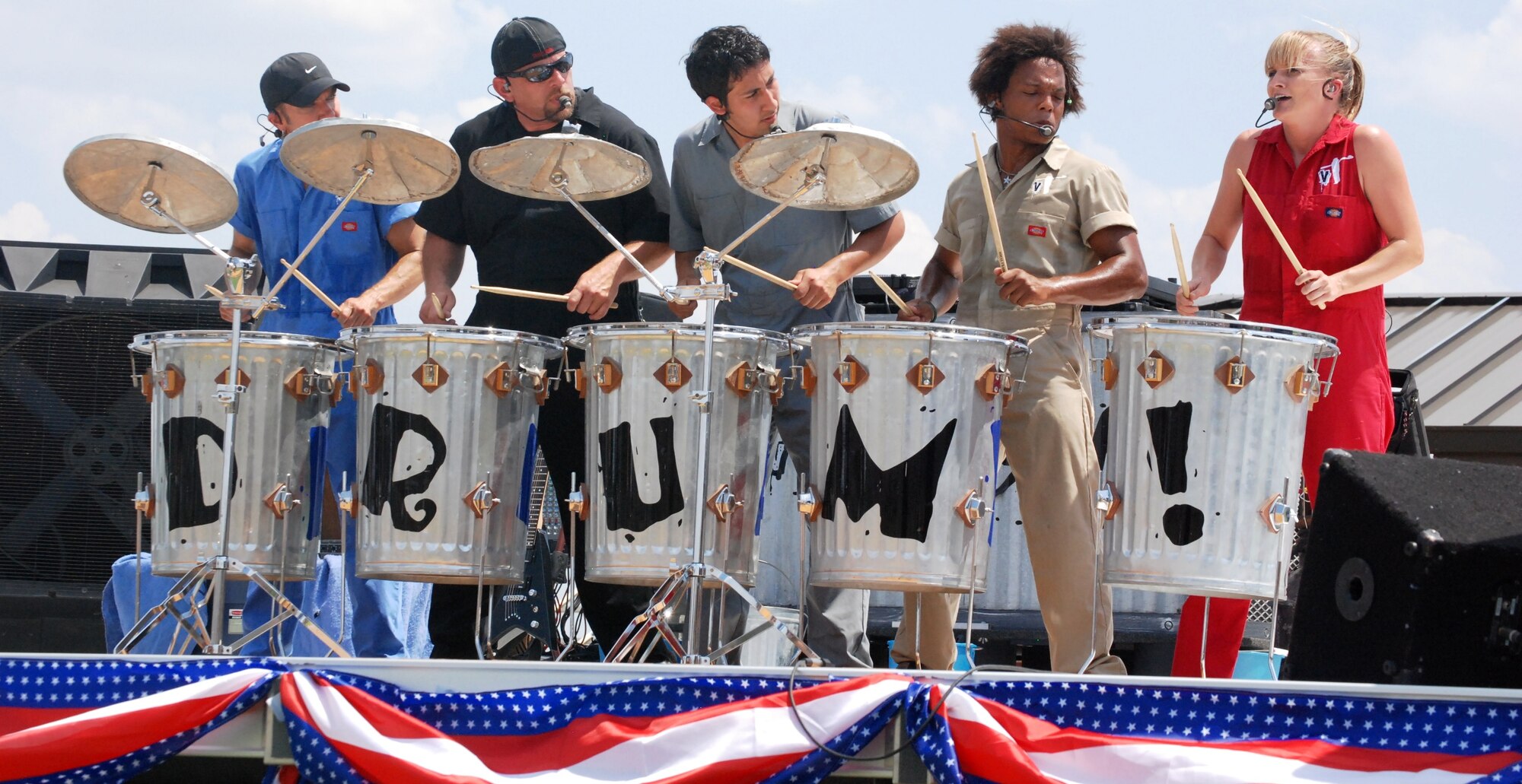 Members of Vocal Trash perform at Sheppard's Independence Day celebration July 3. The band performed classic songs with high energy using vocals, humor and street instruments. Some songs performed include "American Woman," "Sing, sing, sing," "I want Candy" and many more. The celebration also included food, water and several stations of activities. (U.S. Air Force photo/Airman 1st Class Candy Miller)