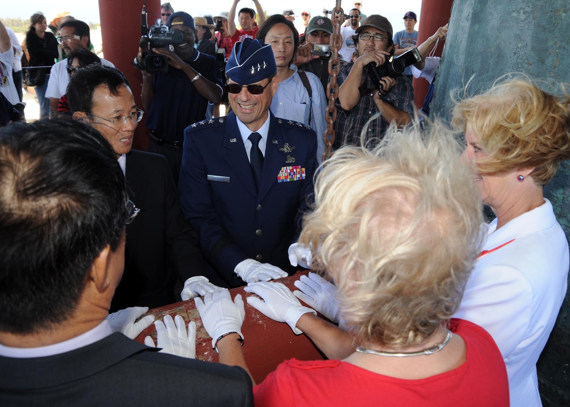 Lt. Gen. Tom Sheridan, Space and Missile System Center commander, joined local civic leaders and officials of the Republic of Korea government in ringing the Korean Bell, July 4. The bell, a gift from Republic of Korea in 1976, is rung four times per year.  It’s located in Angels Gate Park in San Pedro. (Photo by Lou Hernandez)