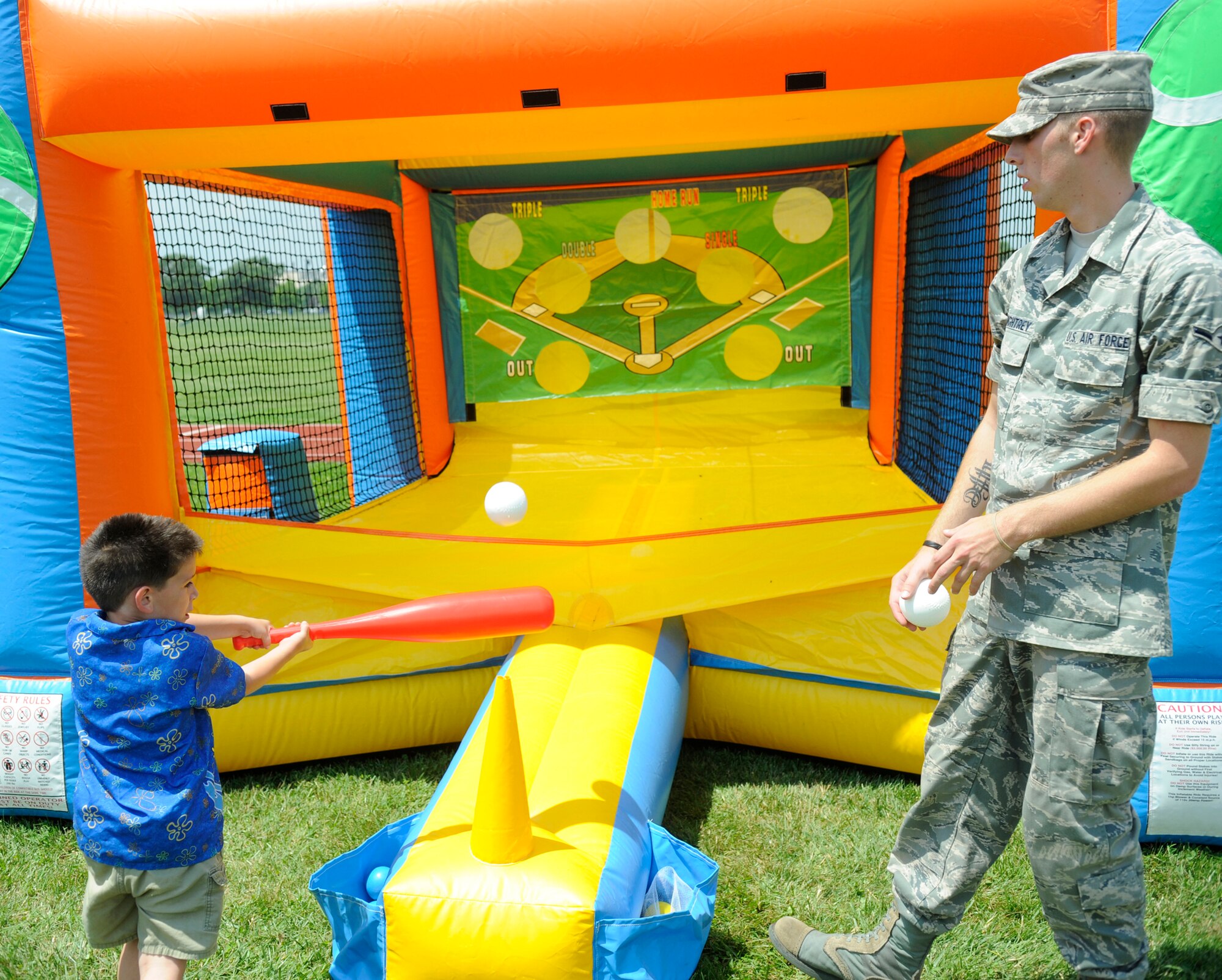 Families enjoyed playing games, including air t-ball, during the MatchUp Picnic 2009 outside The Club July 2. Participants also enjoyed free lunch and inflatable amusements during the 87th Force Support Squadron-hosted event. (U.S. Air Force photo/Carlos Cintron)