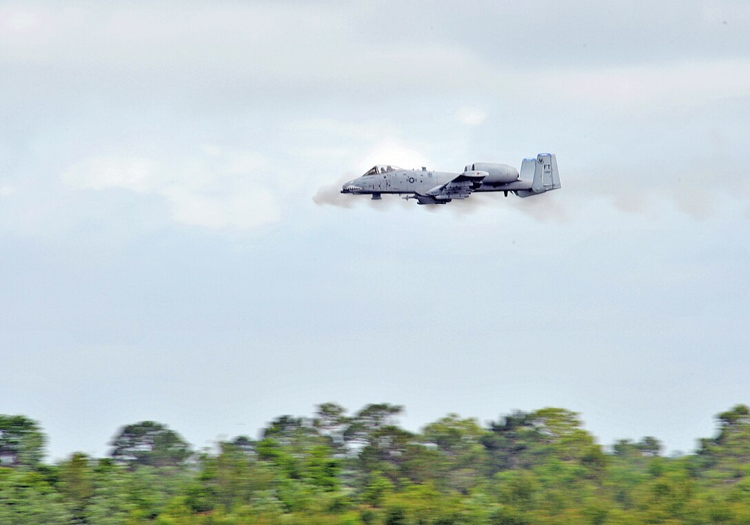 An A-10 Thunderbolt II from the 75th Fighter Squadron engages with a simulated enemy element that is closing in on the position of a downed pilot who is awaiting rescue during a live-fire and rescue demonstration May 15 at Moody Air Force Base, Ga. (U.S. Air Force photo/Staff Sgt. Javier Cruz Jr.)