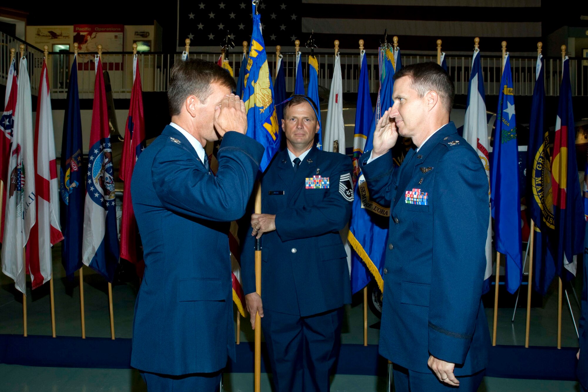 Col. Bruce McClintock, 96th Air Base Wing commander, returns a salute to Col. Gary Walker during a change of command ceremony July 8, at Eglin Air Force Base, Fla. Colonel Walker takes command of the group from Col. Tama Van Decar. (U.S. Air Force photo/Bruce Hoffman.)